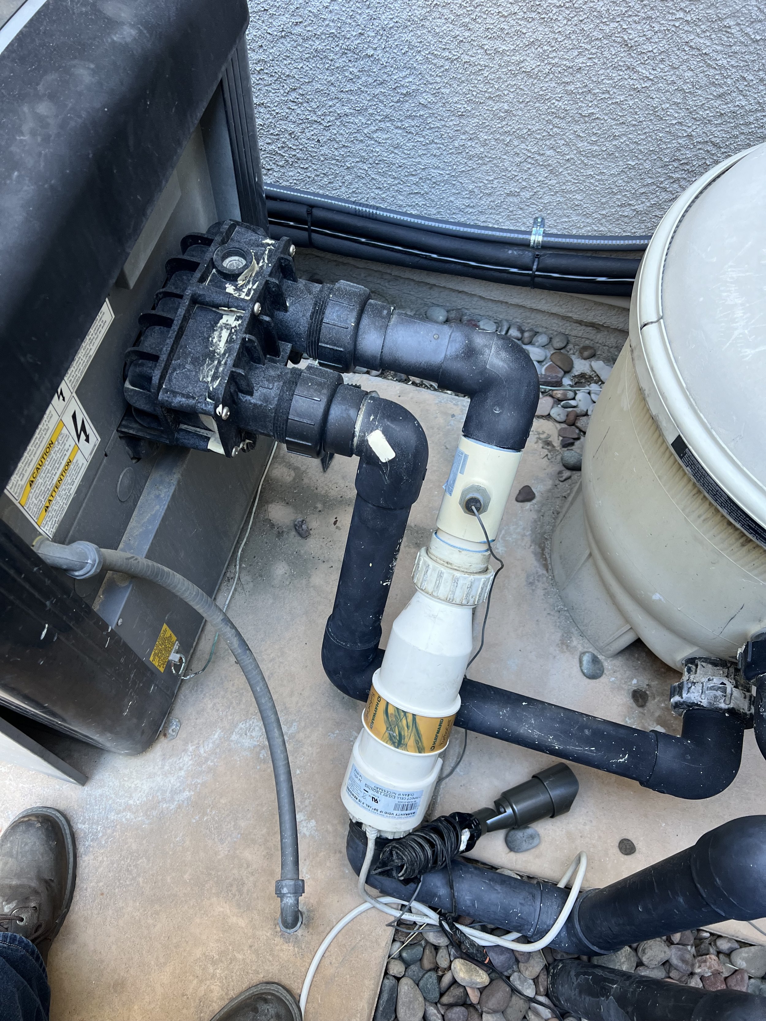 Pool heater and plumbing pipes setup outdoors