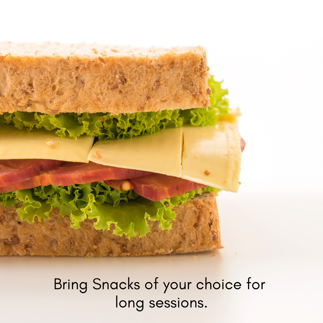 Close-up of a multi-layer sandwich with bread, lettuce, cheese, and meat, on a white background.