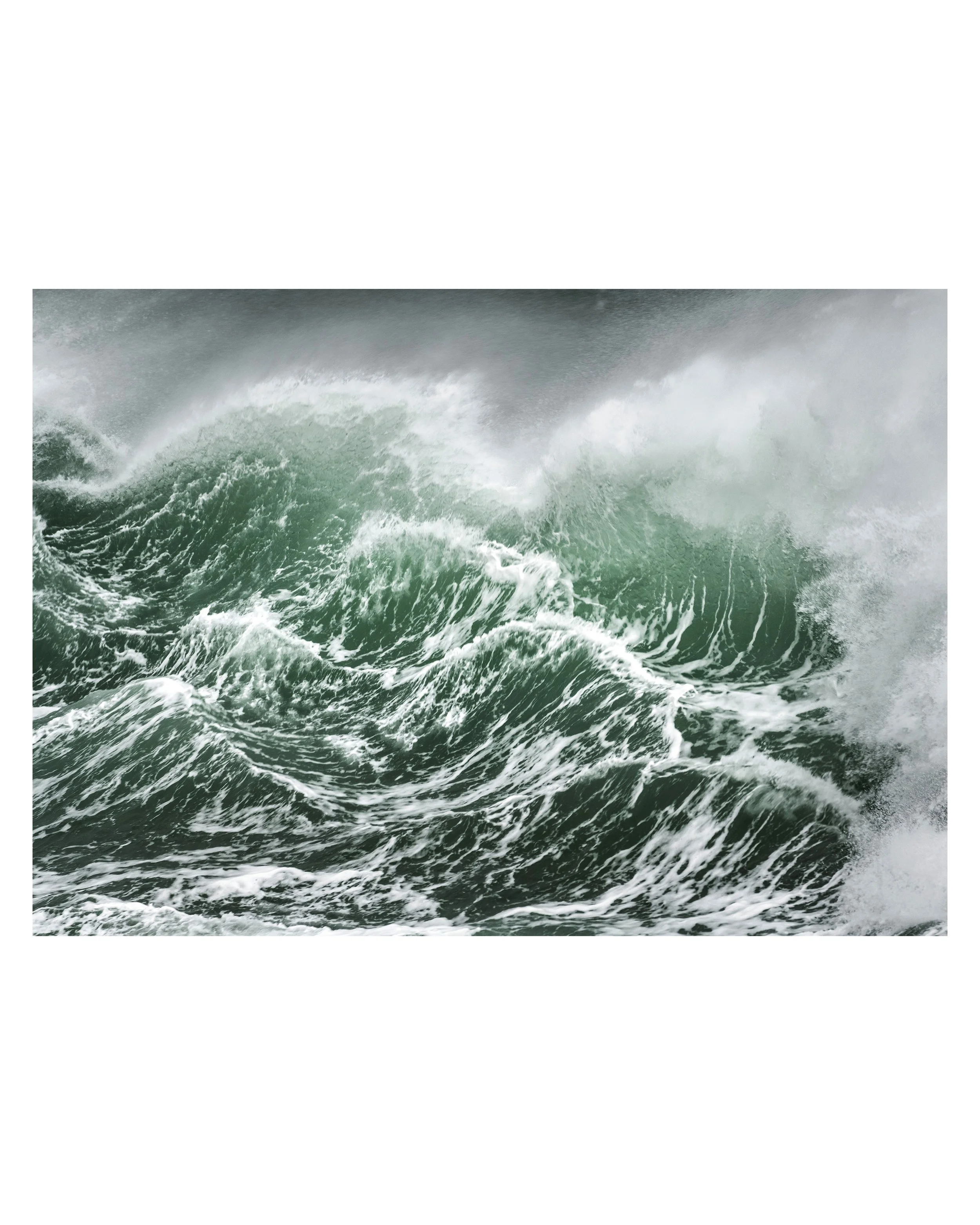 Emerald Fury photography print of a powerful green Atlantic wave breaking in close‑up, inspired by the Outer Hebrides coastline, with curved water and textured spray.