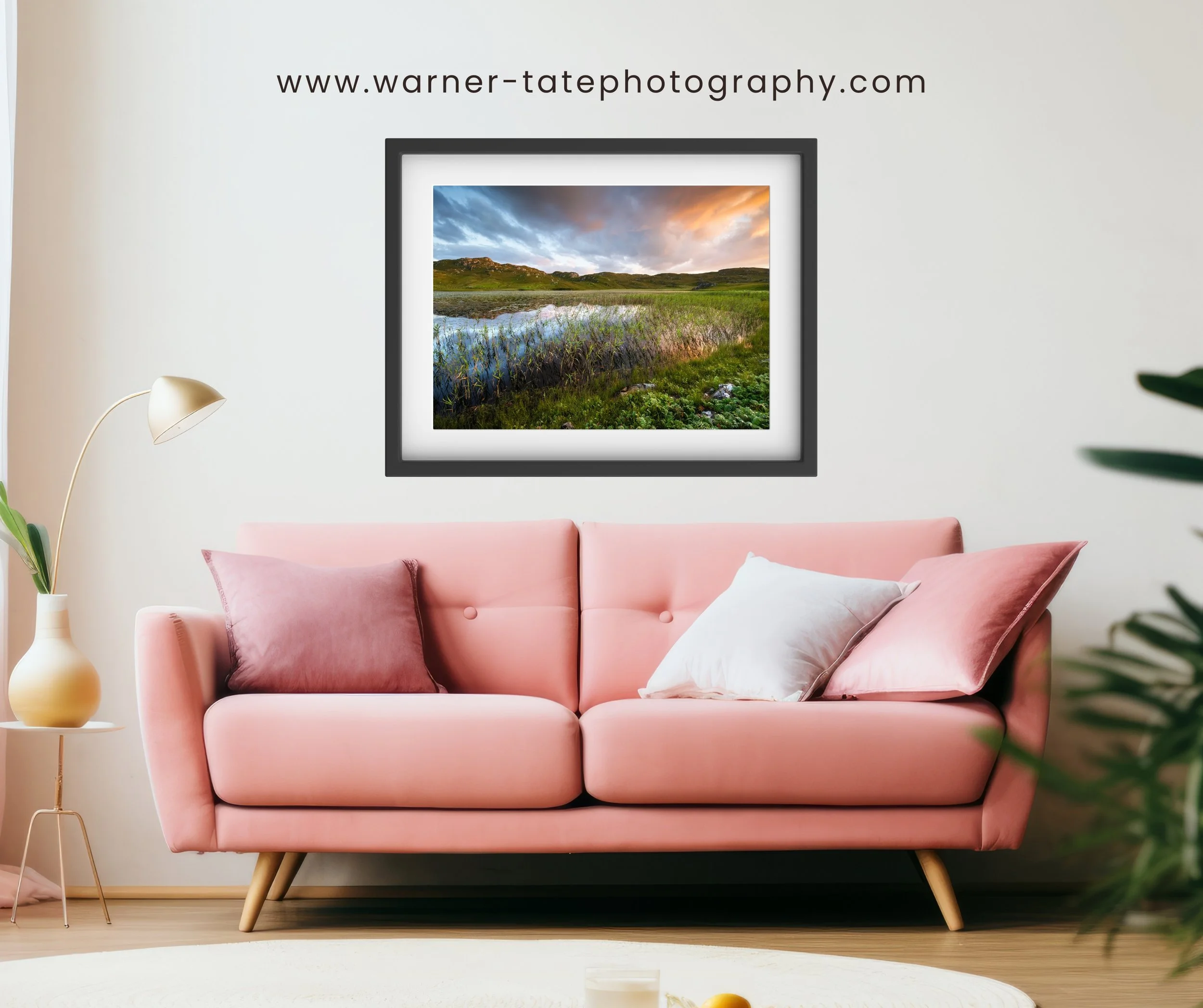 Framed print of “Dalbeg Loch” displayed on a wall, showing evening light on grasses and still water.