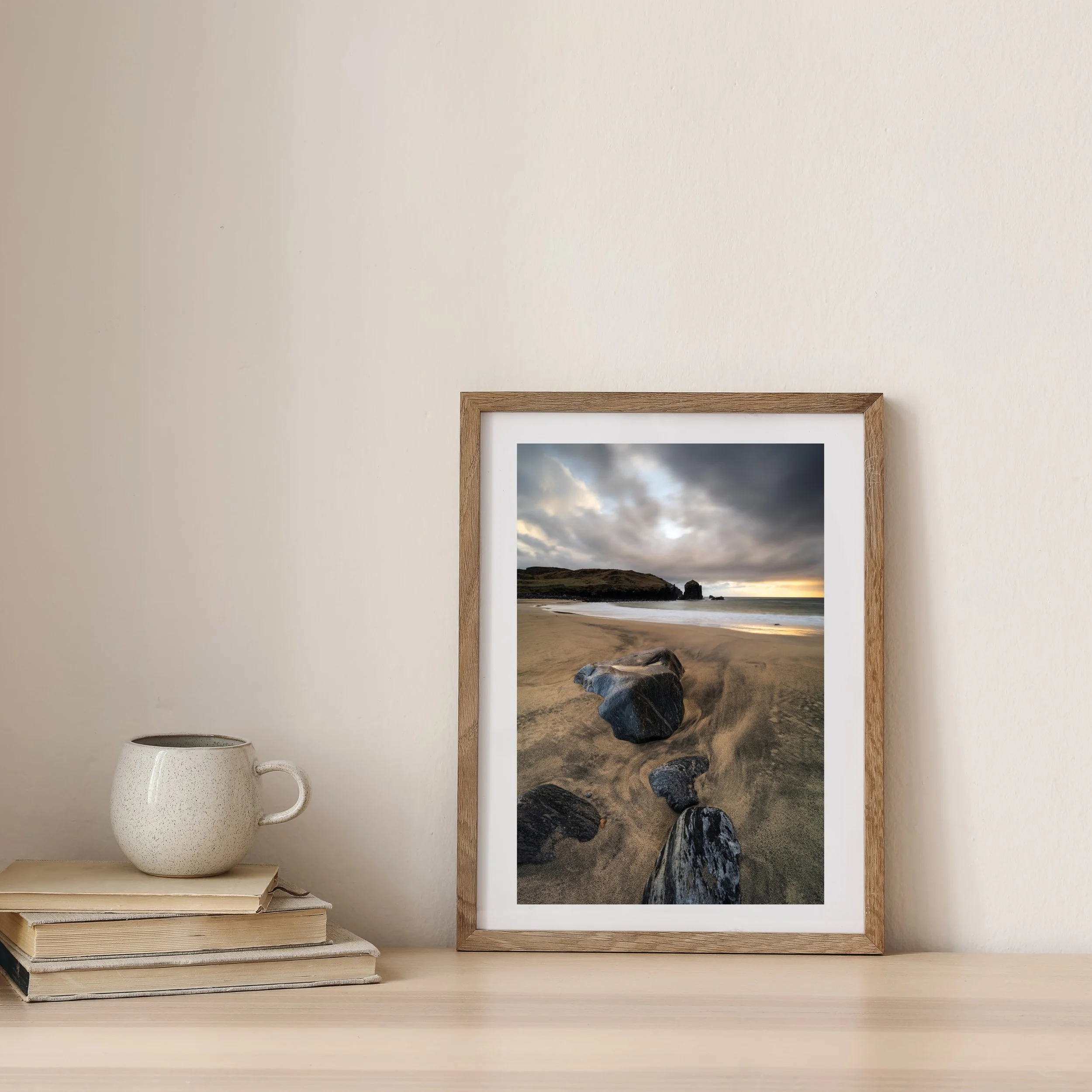 Dalbeg Beach at sunset photography print with warm light on the cliffs and soft Atlantic waves on the Isle of Lewis.