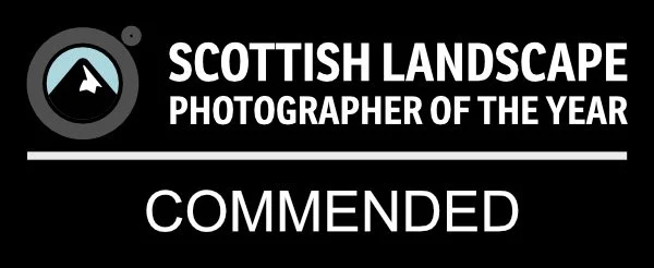 Award badge with a mountain icon that reads 'Scottish Landscape Photographer of the Year' and the word 'Commended' in bold.