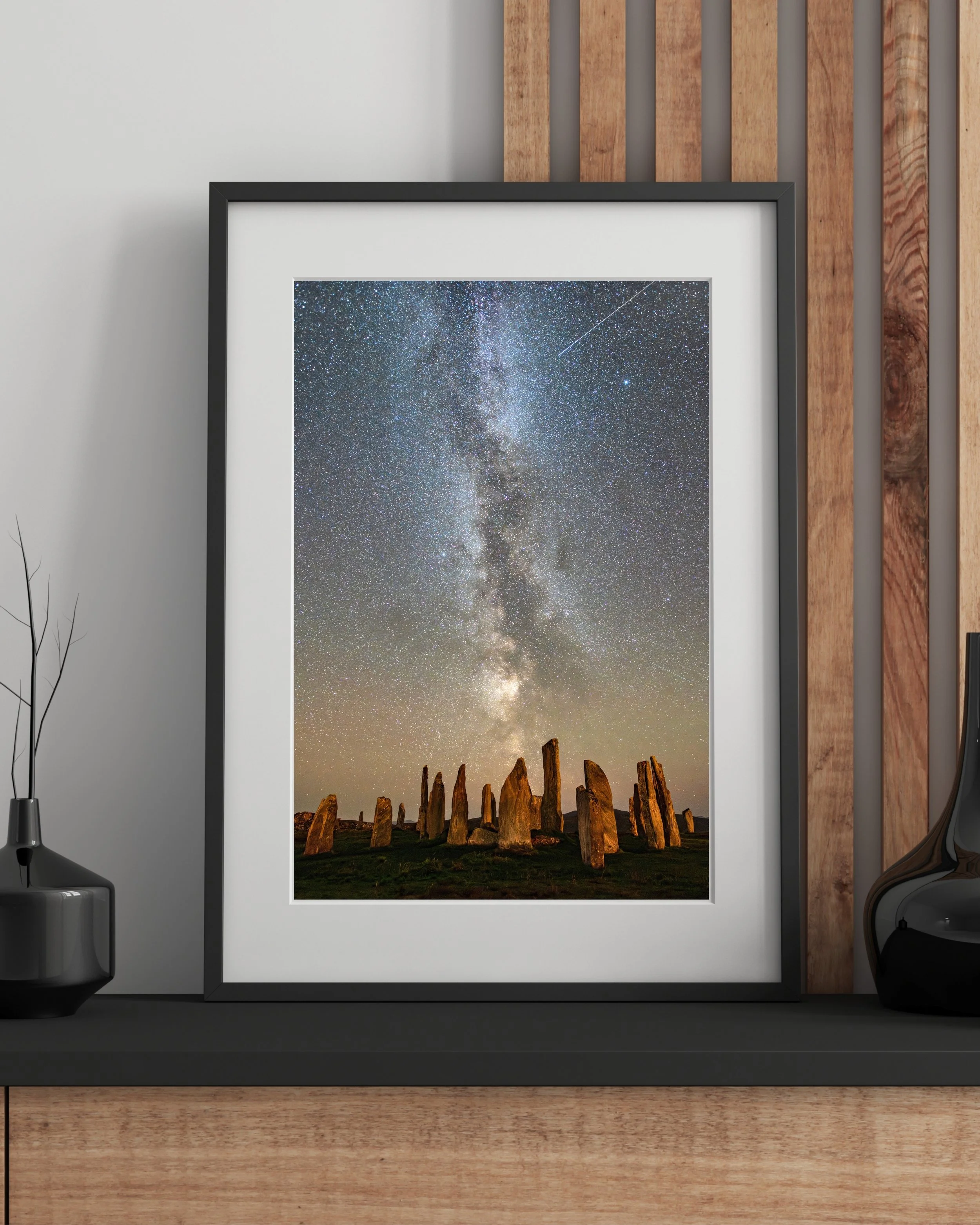 Interior mockup showing the Callanish Standing Stones Milky Way print in a frame.