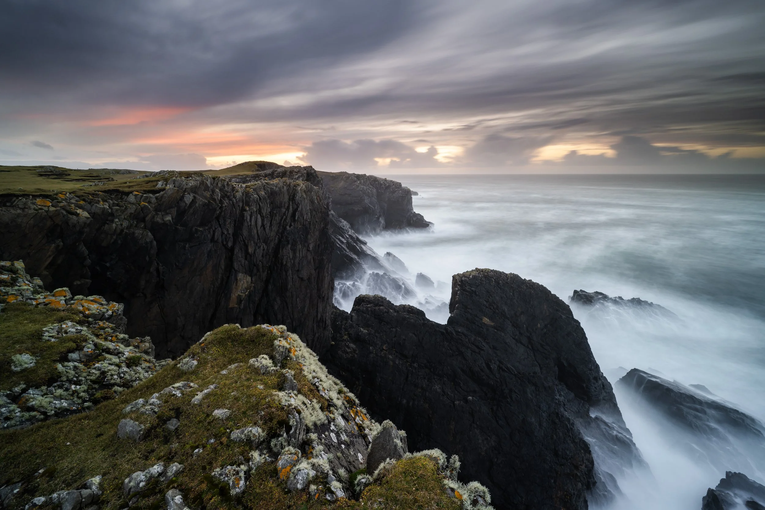 Butt of Lewis, Isle of Lewis Outer Hebrides. Long expsoure seascape photography detailing the rugged cliffs of the Butt of Lewis. Sunset colours in the sky with an incredible view out to sea