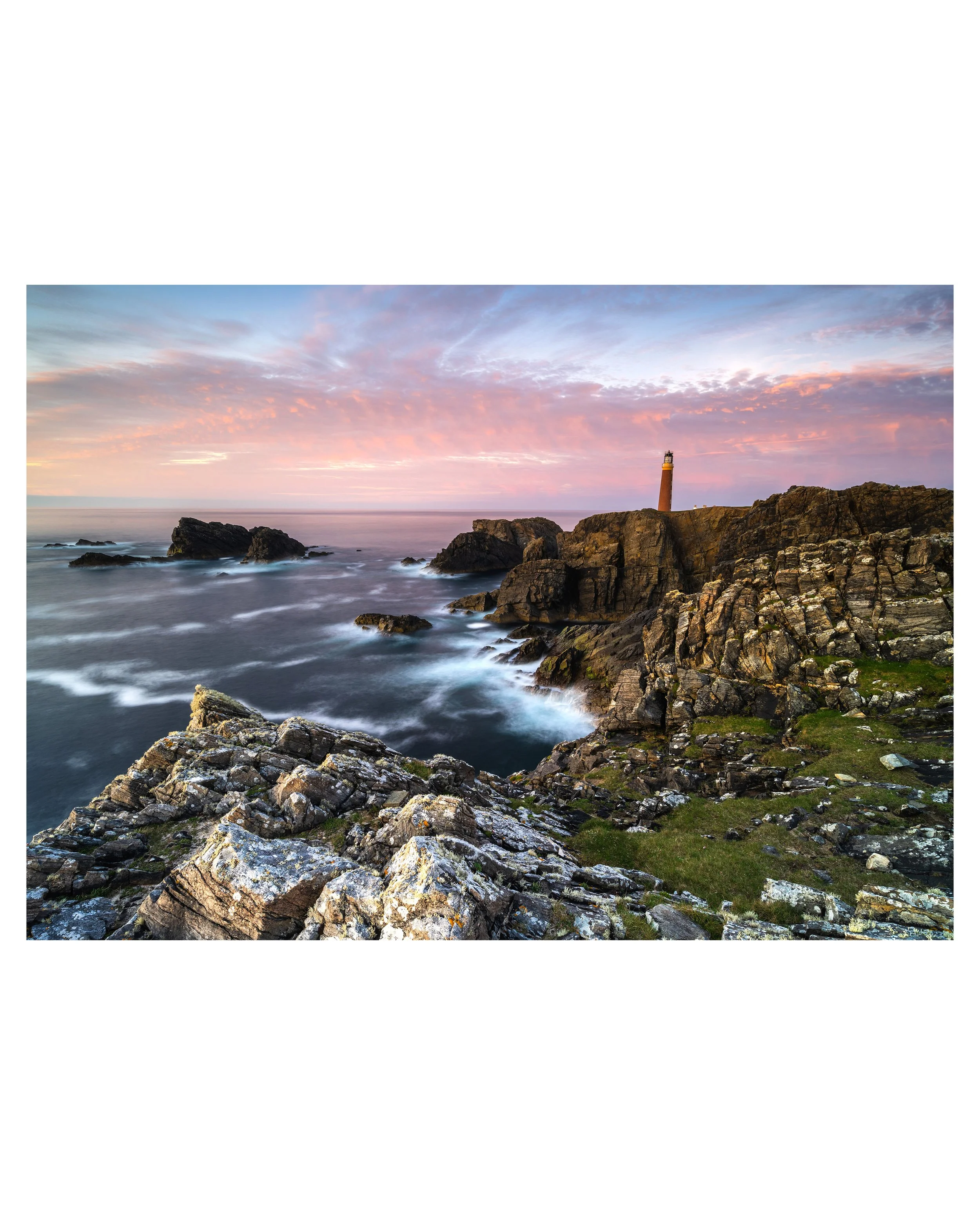 Fine‑art seascape print showing the Butt of Lewis lighthouse with warm evening light and long‑exposure Atlantic waves.