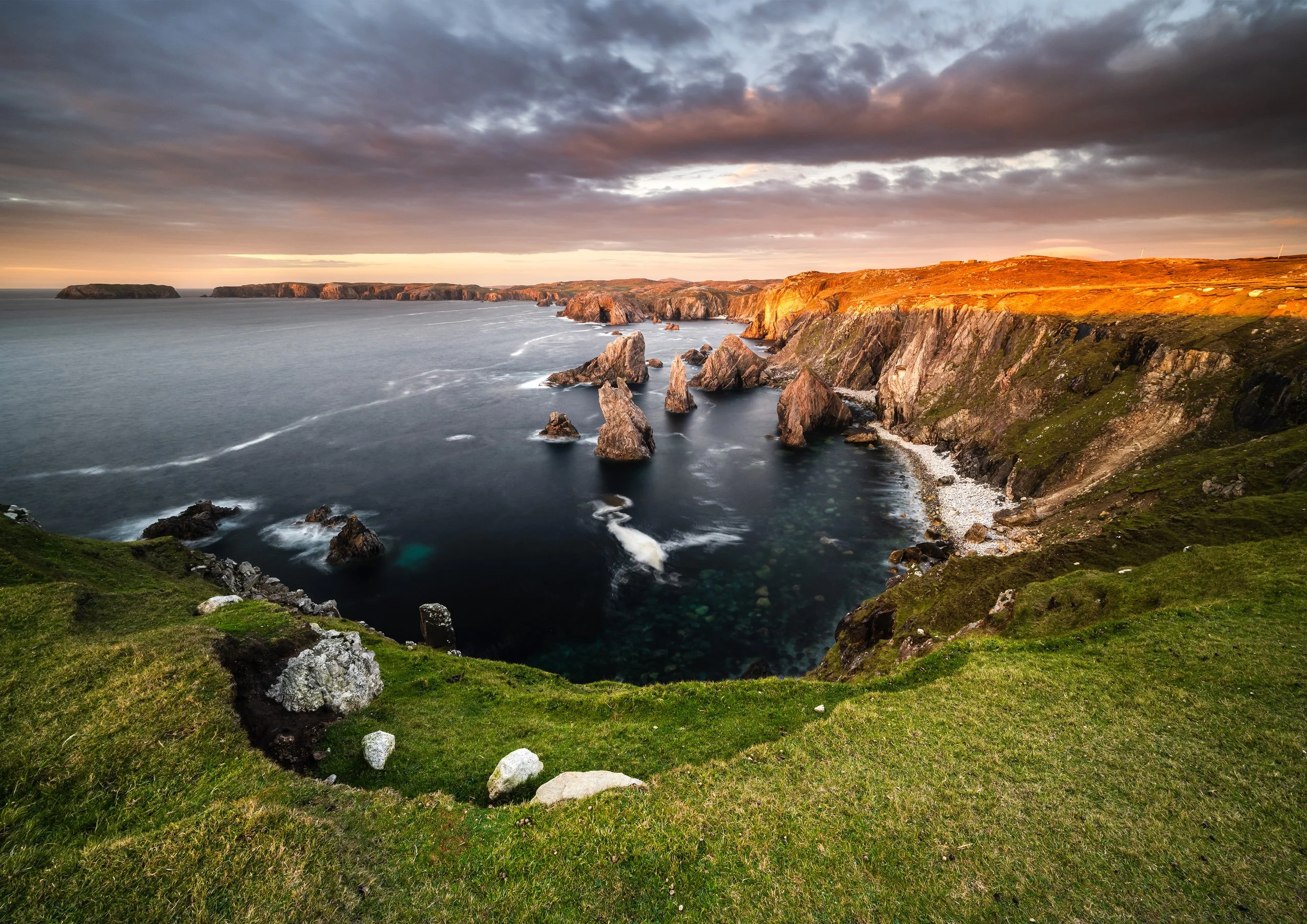 Mangersta Sea Stacks during a golden sunset with the Atlantic Ocean Below, Isle of Lewis, Outer Hebrides