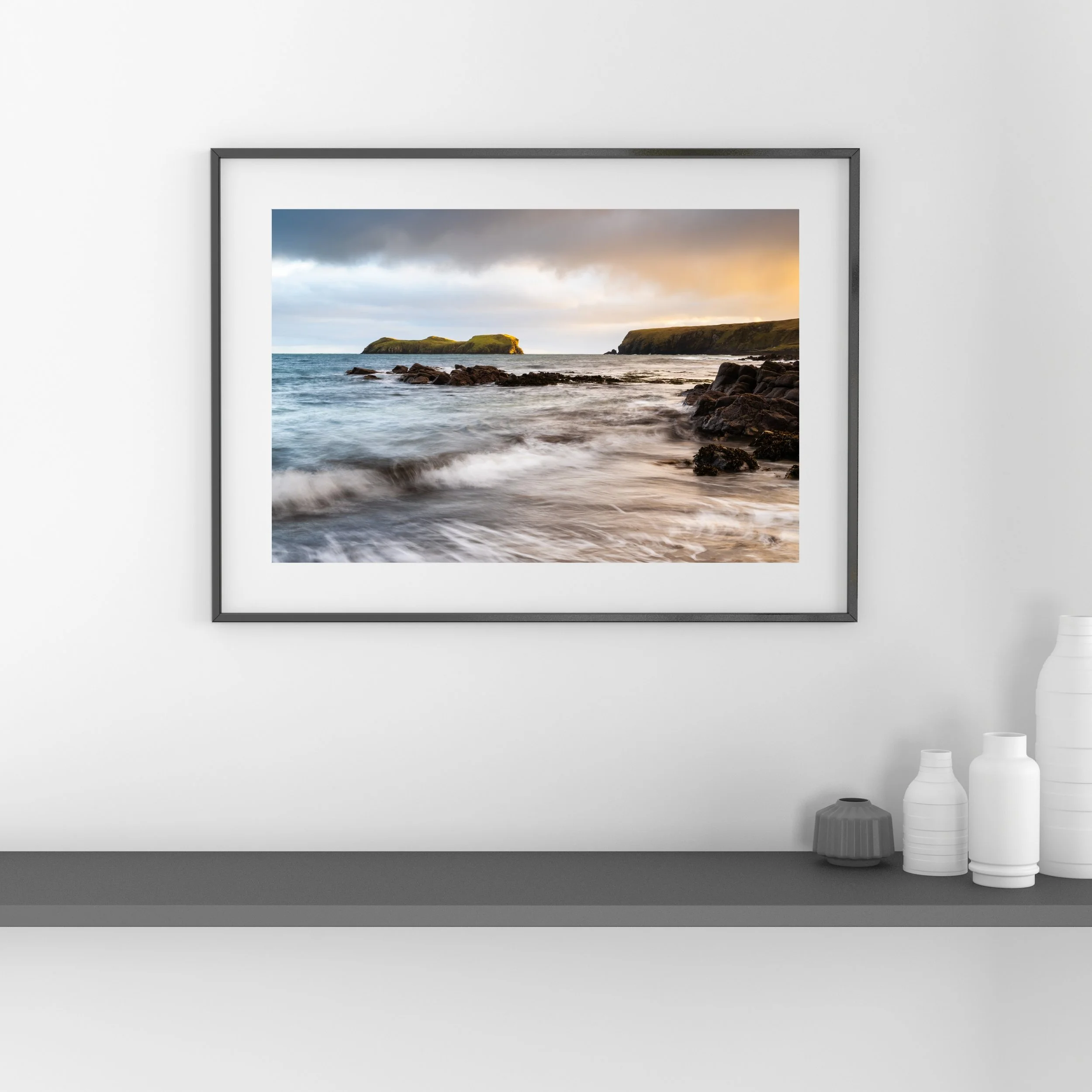 Framed fine‑art print of Bayble Beach displayed on a wall.