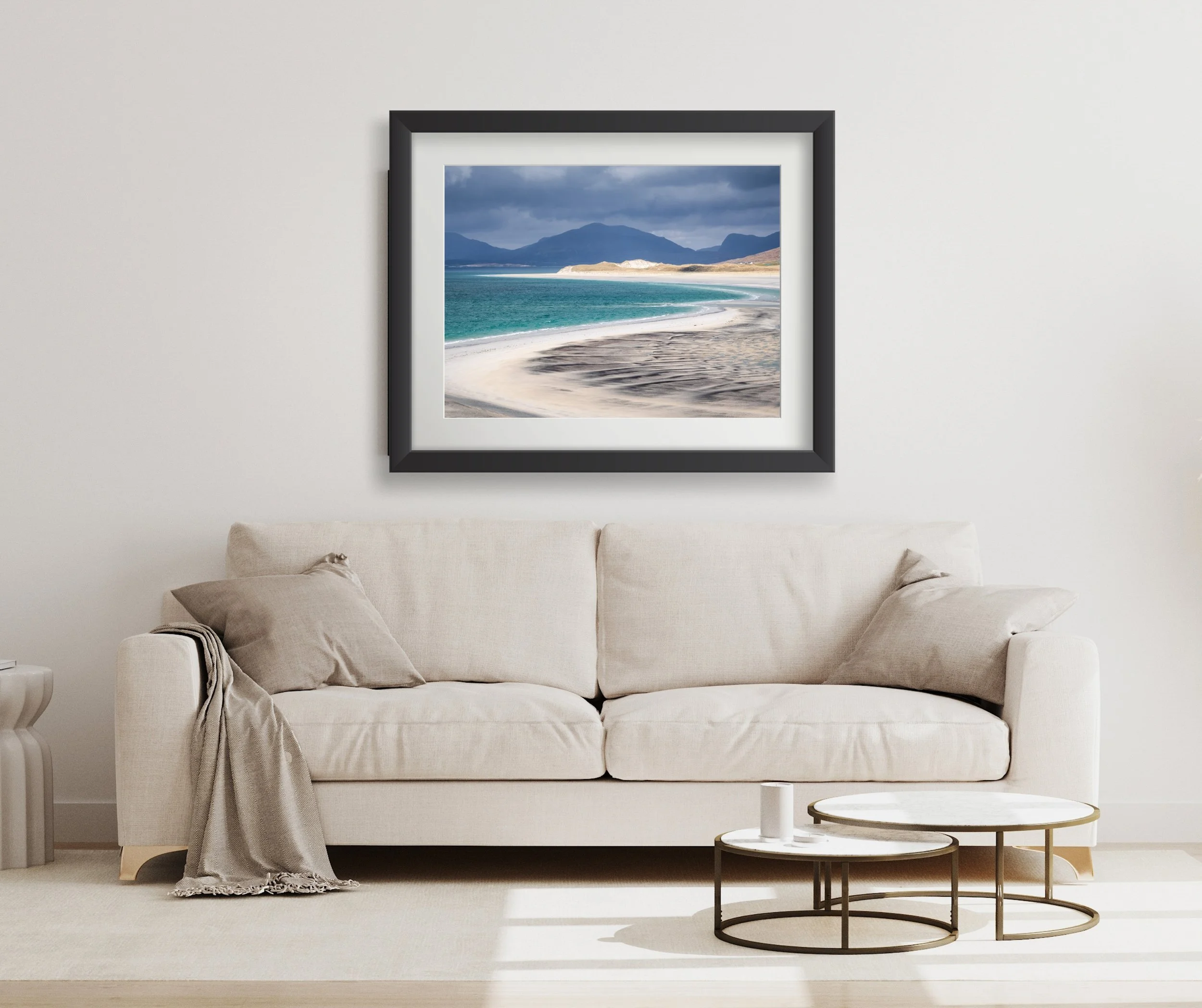 Framed print of “Seilebost View” displayed on a wall, showing pale sands, turquoise water and the Harris hills beyond.
