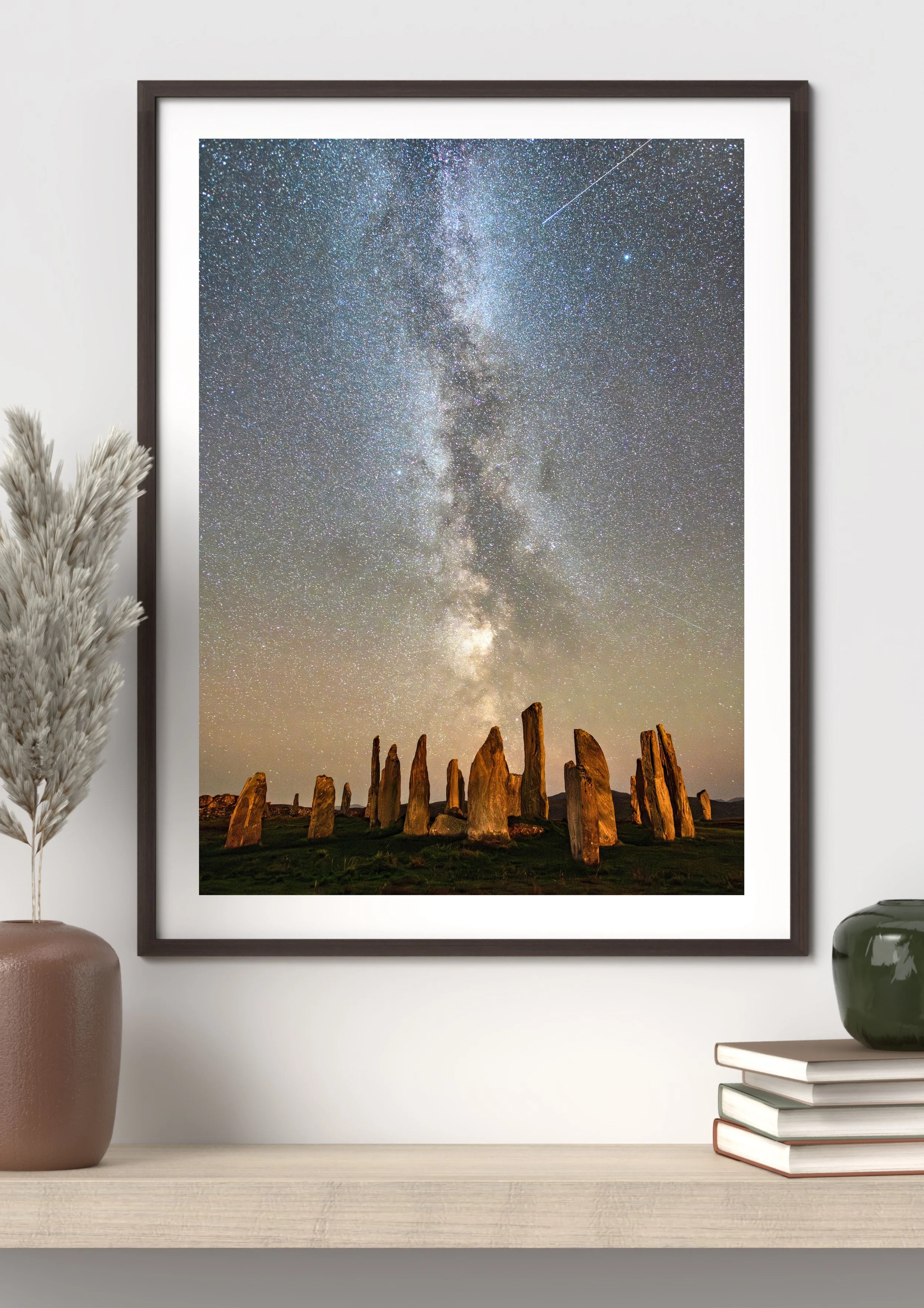 Framed print of “Callanish Milky Way” displayed on a wall, showing the Milky Way arching above the Callanish Stones under clear winter skies.