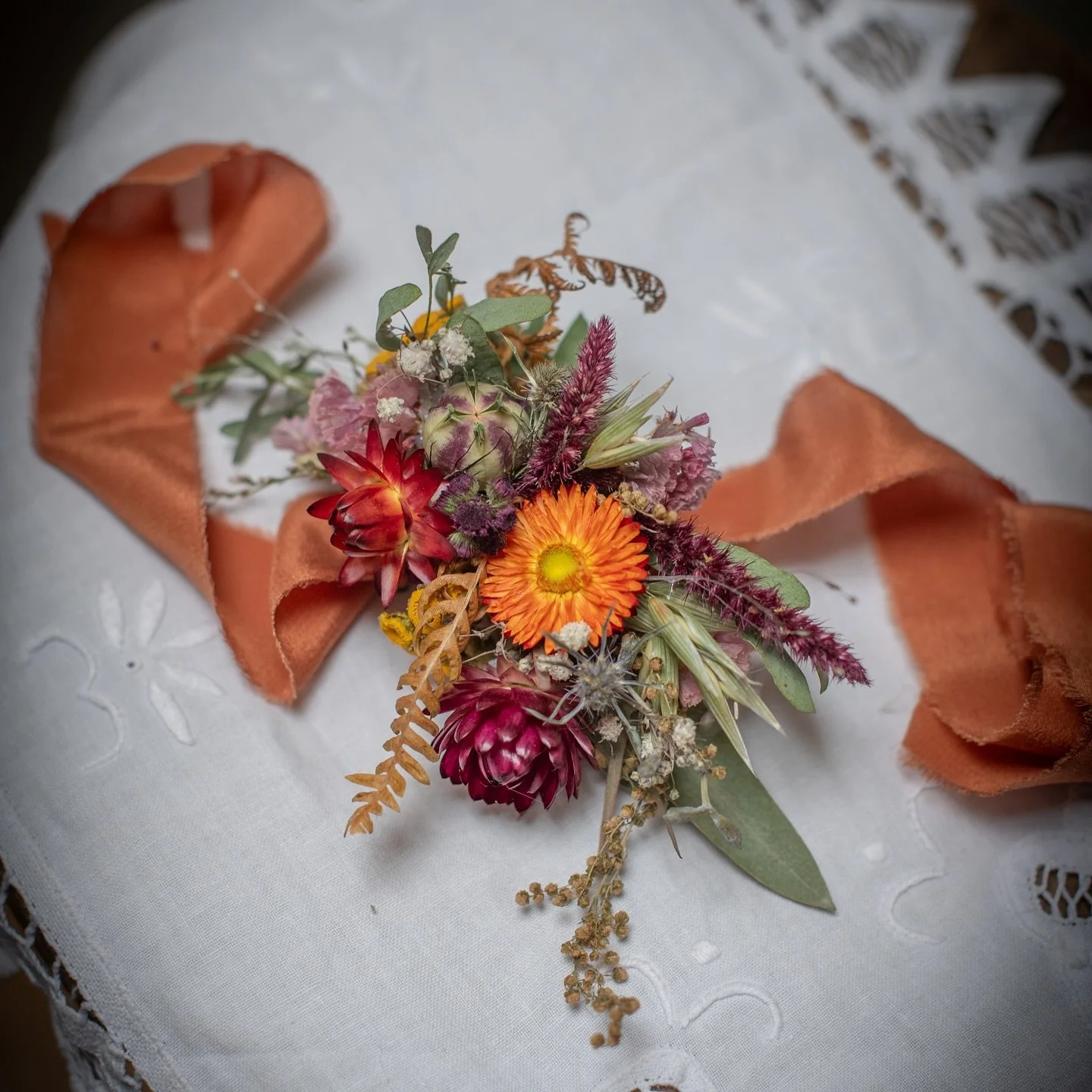 A set of dried floral pieces for an October wedding, with a few little thistles in there for Scotland. As my bride was going without a bouquet, she was keen for a little extra impact with the wrist corsage, so it is designed to extend over the hand a