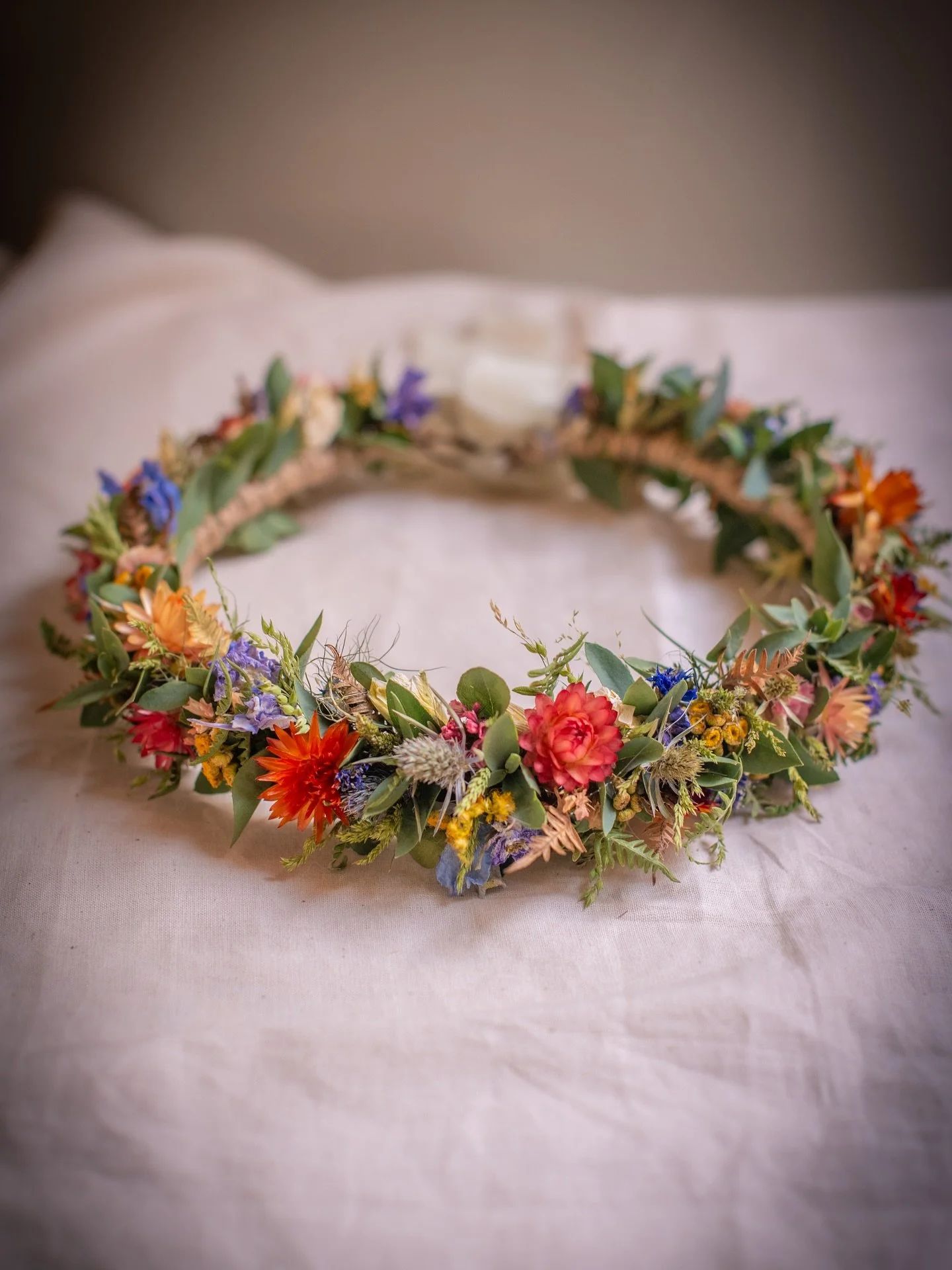 A crown for an Irish fairy 🧚&zwj;♀️ 
Lots of greens, thistle and bracken fronds for a fairytale engagement shoot on the Irish coast, and pops of dried flower colour to fit with the colours of wedding to come. 
.
.
.
.
Bespoke Dried flower crown | wh