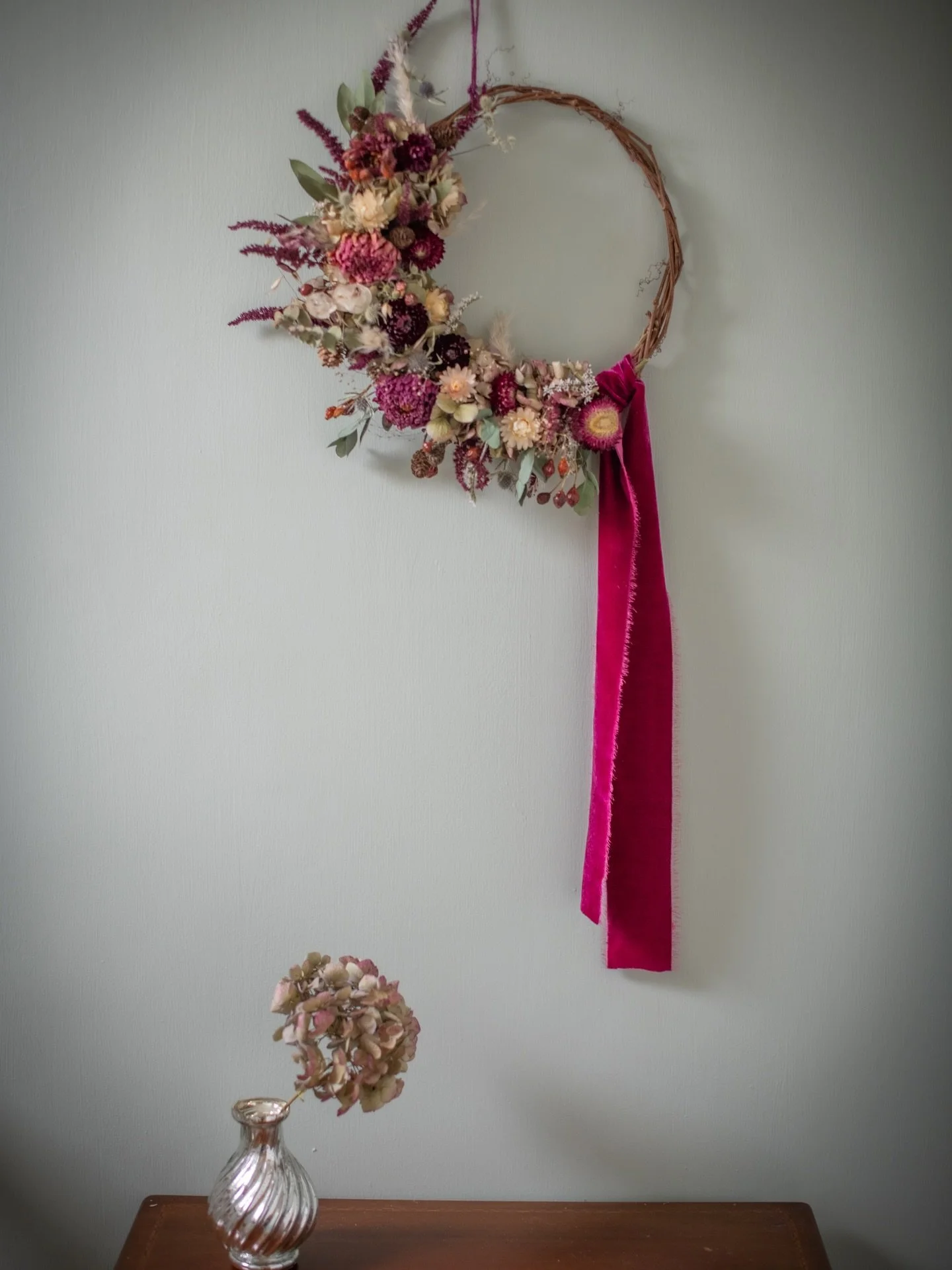 The last (for now) of my wreaths available at Geo Cafe.  A little larger this time and in one of the most popular combinations for my wreaths- burgundy strawflowers, dahlias and amaranthus; dried rose hips, alder cones, hydrangeas and a touch of spar