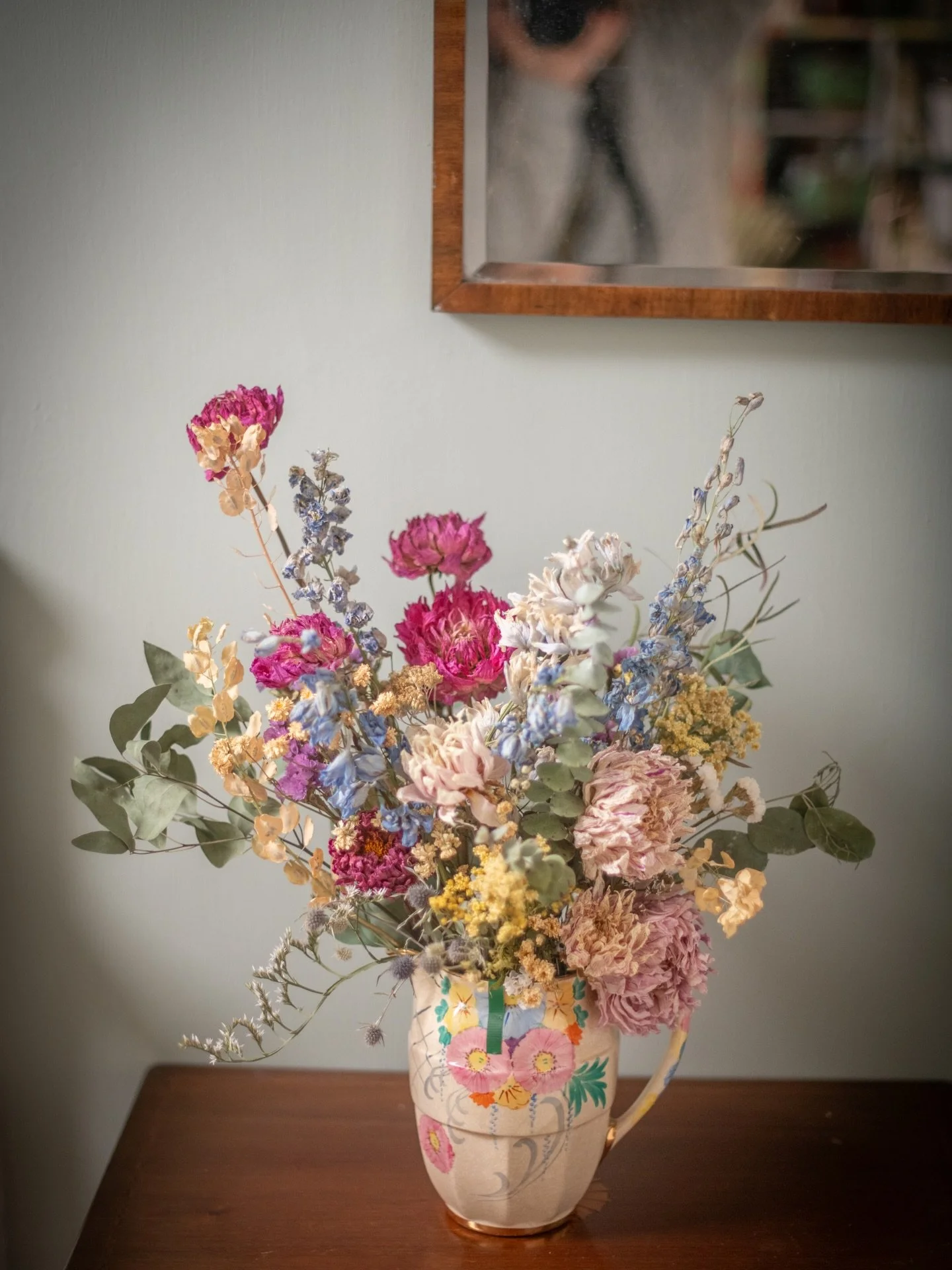 I&rsquo;ve loved this jug sitting on my desk for quite some time, but it deserved filling! I gave it some of my very favourite stems from last year&rsquo;s growing - sky blue delphiniums, and dried dahlias in soft and vibrant pinks. 
.
This arrangeme