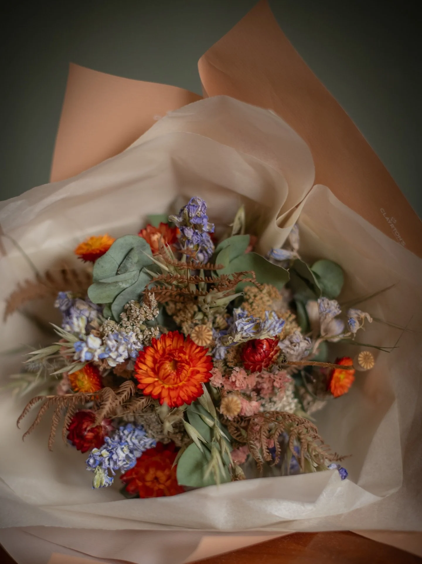 Flowers for Sarah &amp; Adam. 28.3.26 💒 
💙🧡
Burnt orange and dusty blues make a lovely pairing!
.
This is the start of many dried flower weddings- every one individual- I can&rsquo;t wait to show you !!
.
.
.
Bespoke dried flower wedding - bouquet