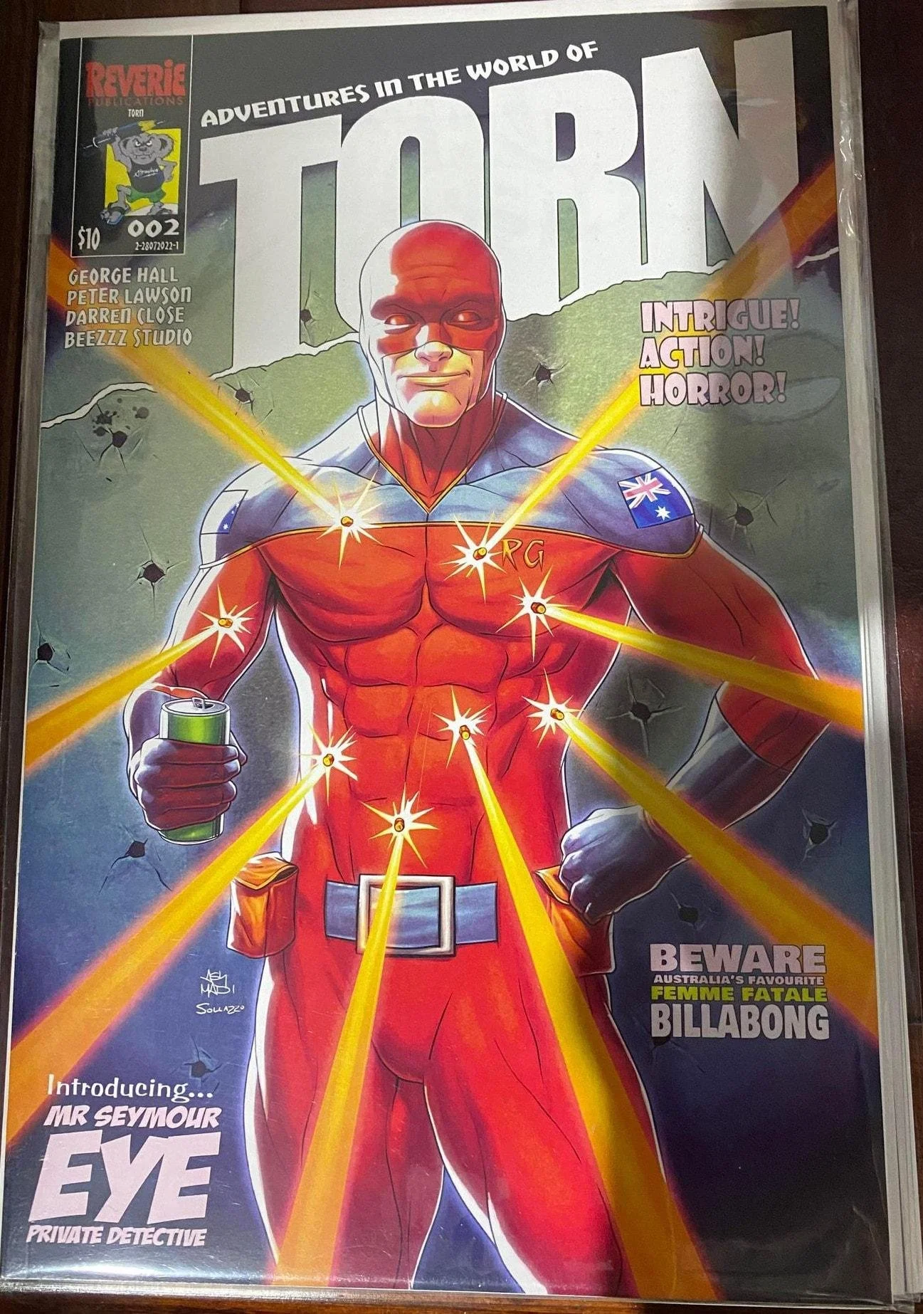 TORN comic book cover featuring a red-suited superhero with glowing energy effects against a dark background.