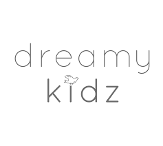 Logo with the words 'dreamy kidz' in lowercase, with a small bird illustration integrated into the letter 'i' in 'kidz'.