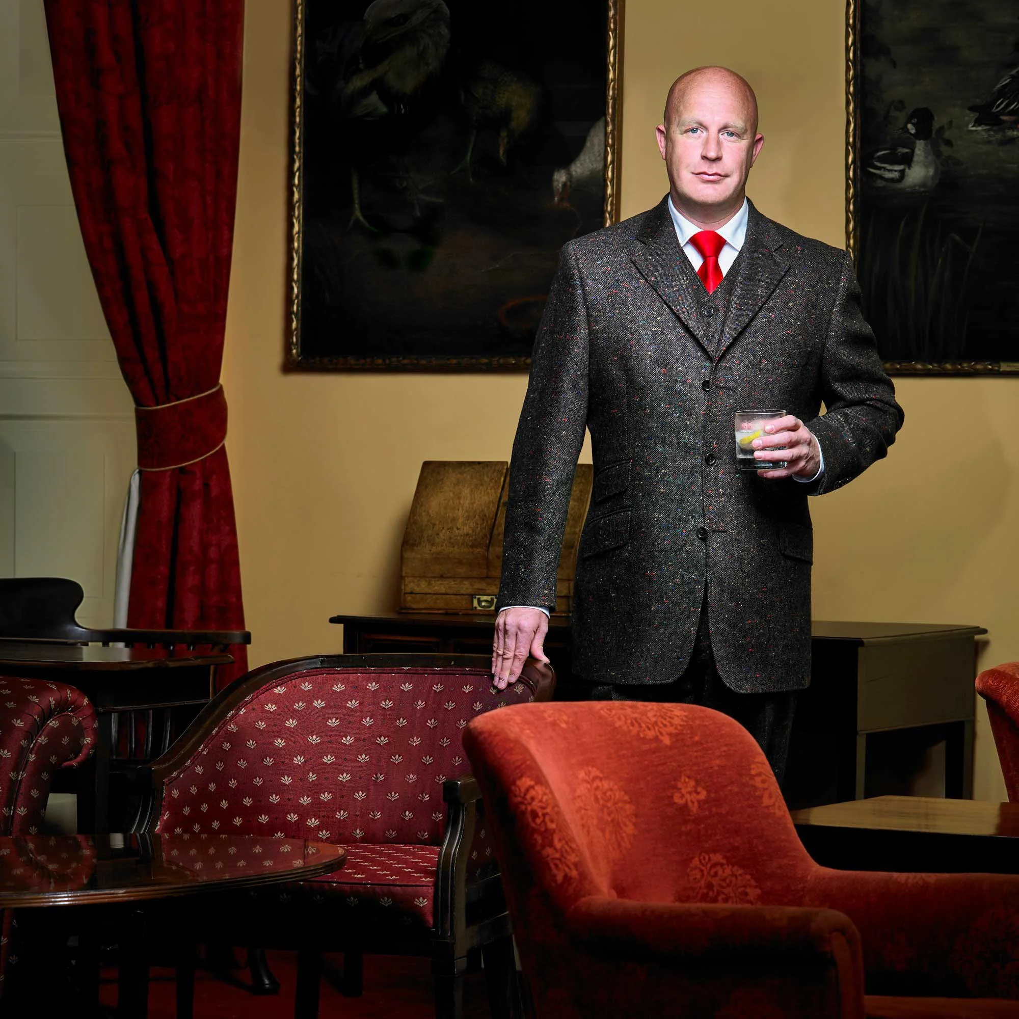 View West Photography | luxury hotel photographer | luxury resort photographer | lifestyle photography | portrait photographer | portrait of a British gentleman in a luxury tailored suit with a gin and tonic | Northern Counties Club | Newcastle.jpg