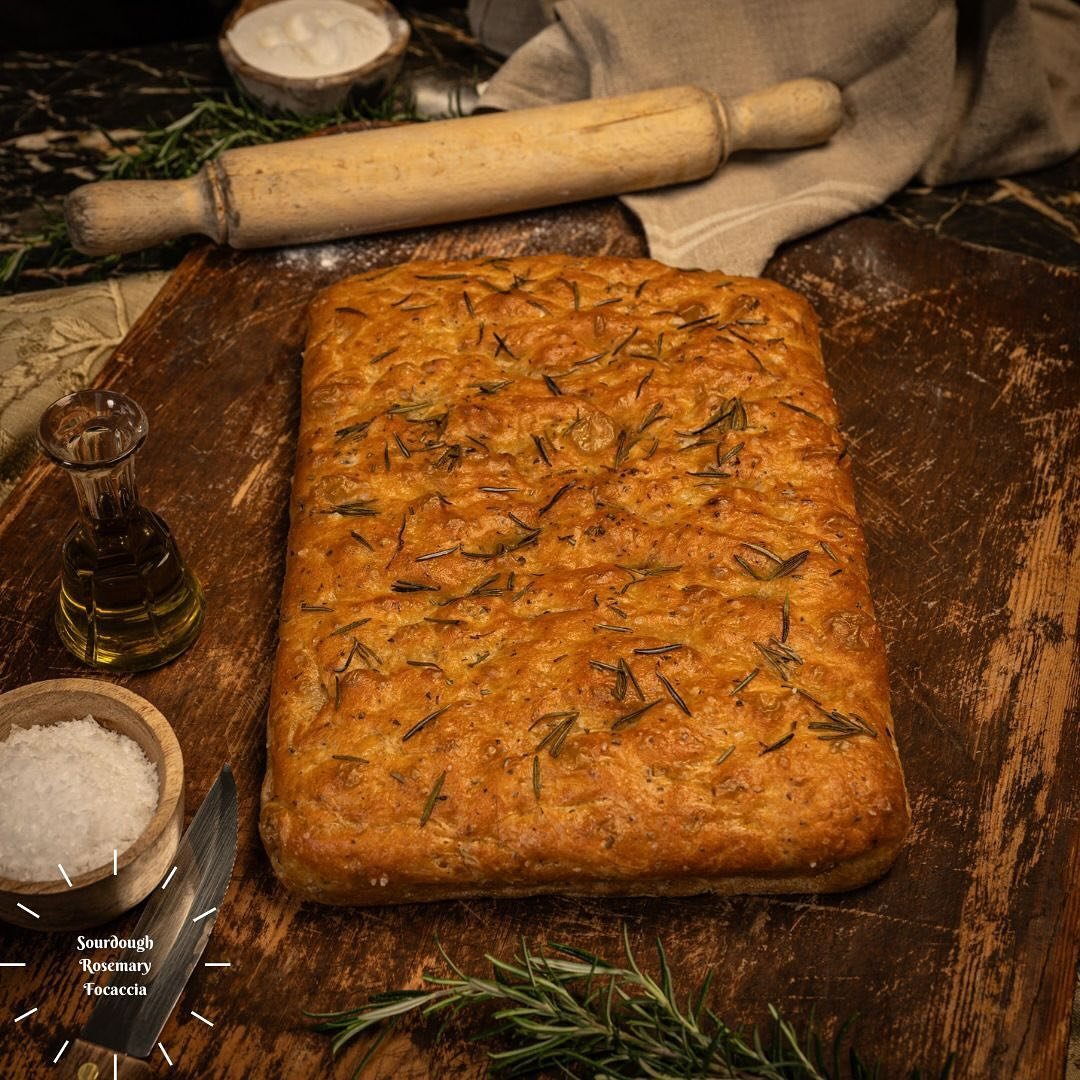 Elevate your bread game with our artisanal Sourdough Focaccia! Indulge in the aromatic Rosemary variety or savor the classic Sea Salted option. Each bite is a burst of flavour and craftsmanship. Which one will you choose? 🍞😋 #SourdoughFocaccia #Art