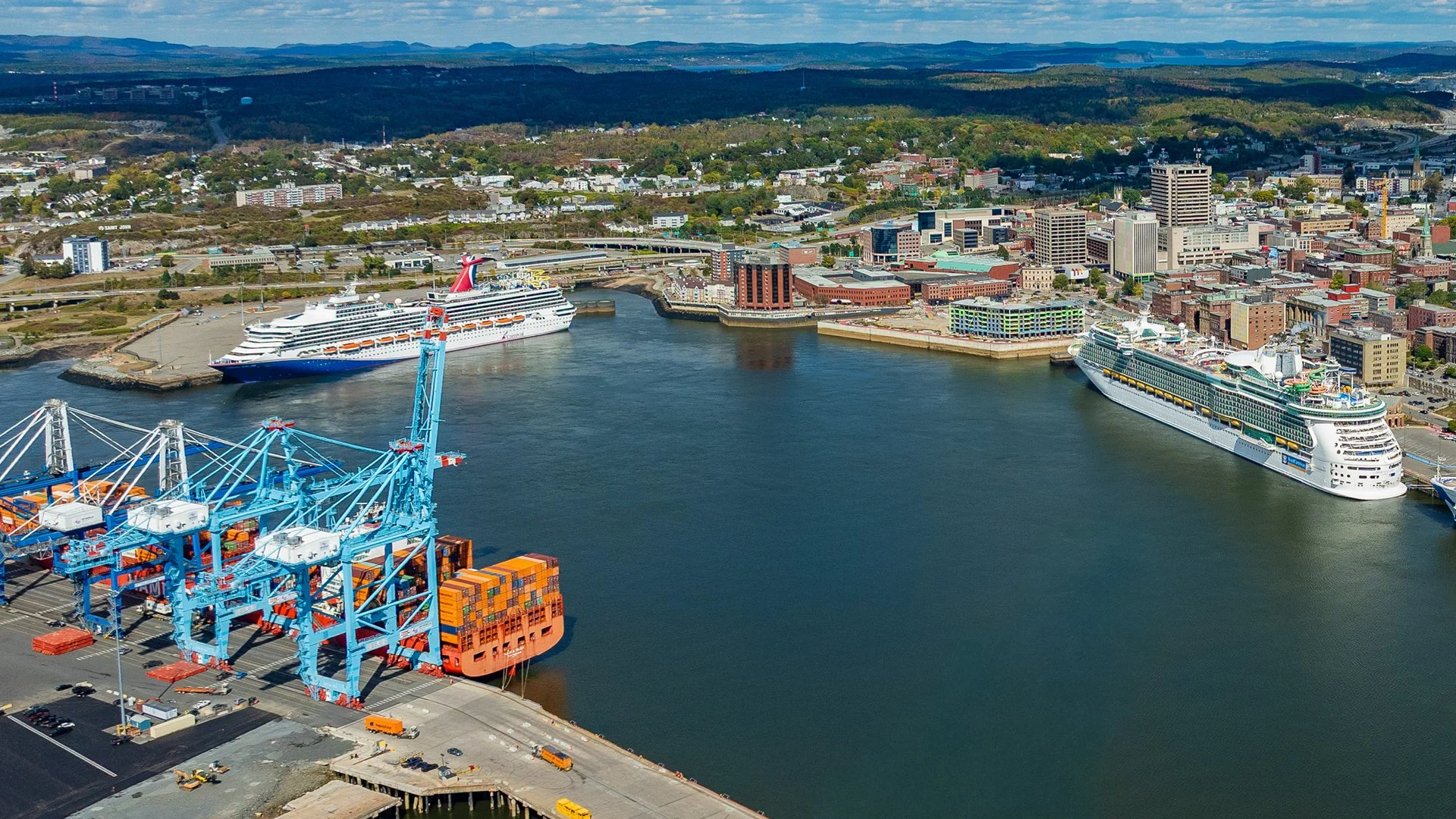 Saint John Harbour with three cruise ships and one cargo vessel