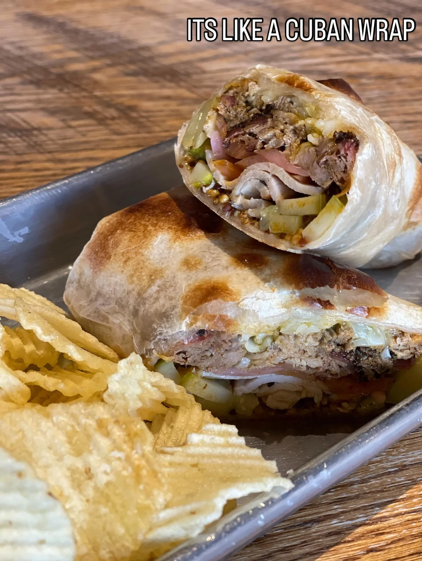 New Year New Menu Item!

We got our adobo-spiced pork, smoked turkey, swiss-cheddar blend, pickled red onions, our house spicy mustard, dill pickles and roasted poblano sauce in a tortilla, then we bake it. 

So yeah, it&rsquo;s kinda like a Cuban.

