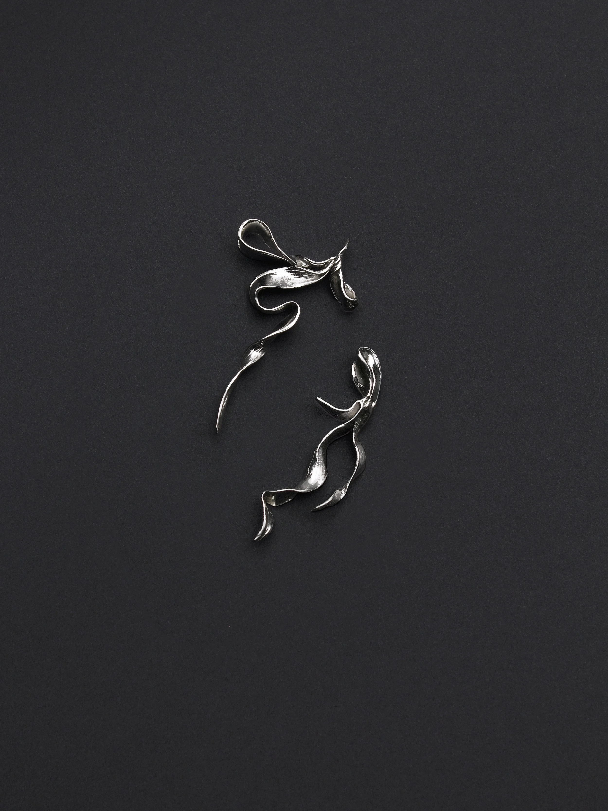 drape earrings in silver lly atelier black background.jpg