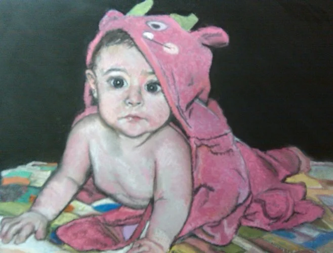Baby portrait with pink monster towel