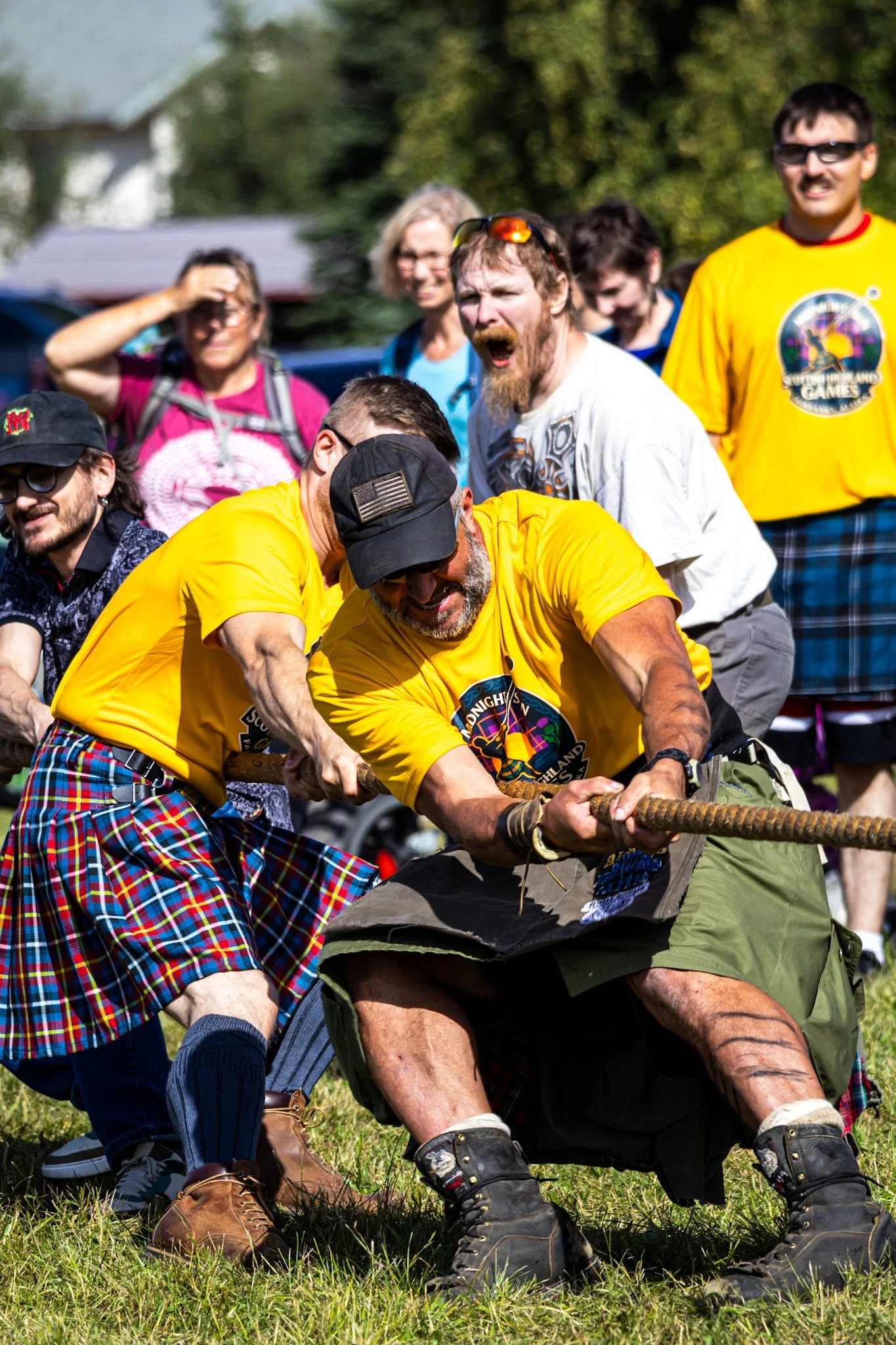 Spectators eagerly cheer on Tug-of-War competitors.
