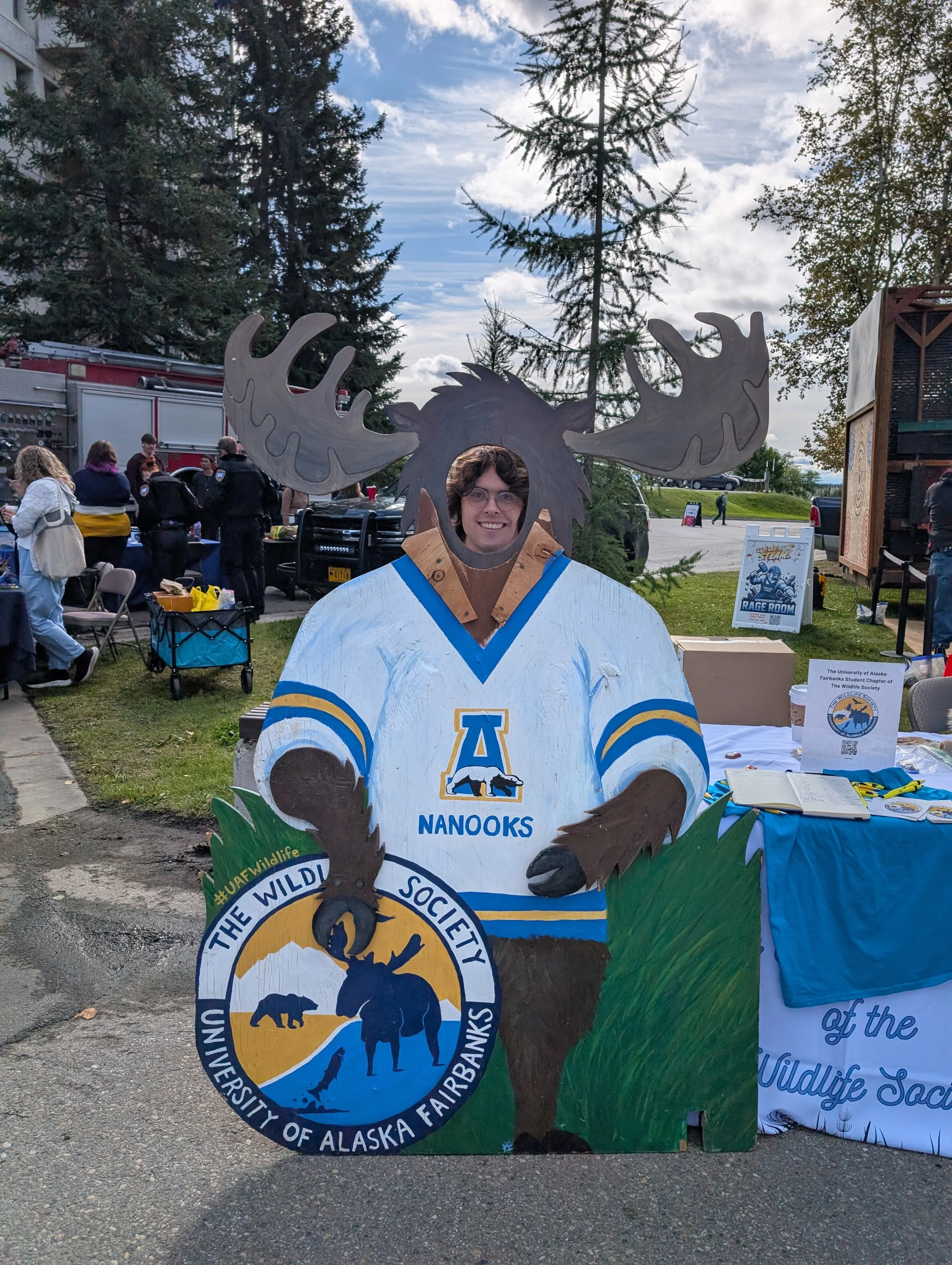 Louis Seymour poses at the Wildlife Society at tabling event in Constitution Park.
