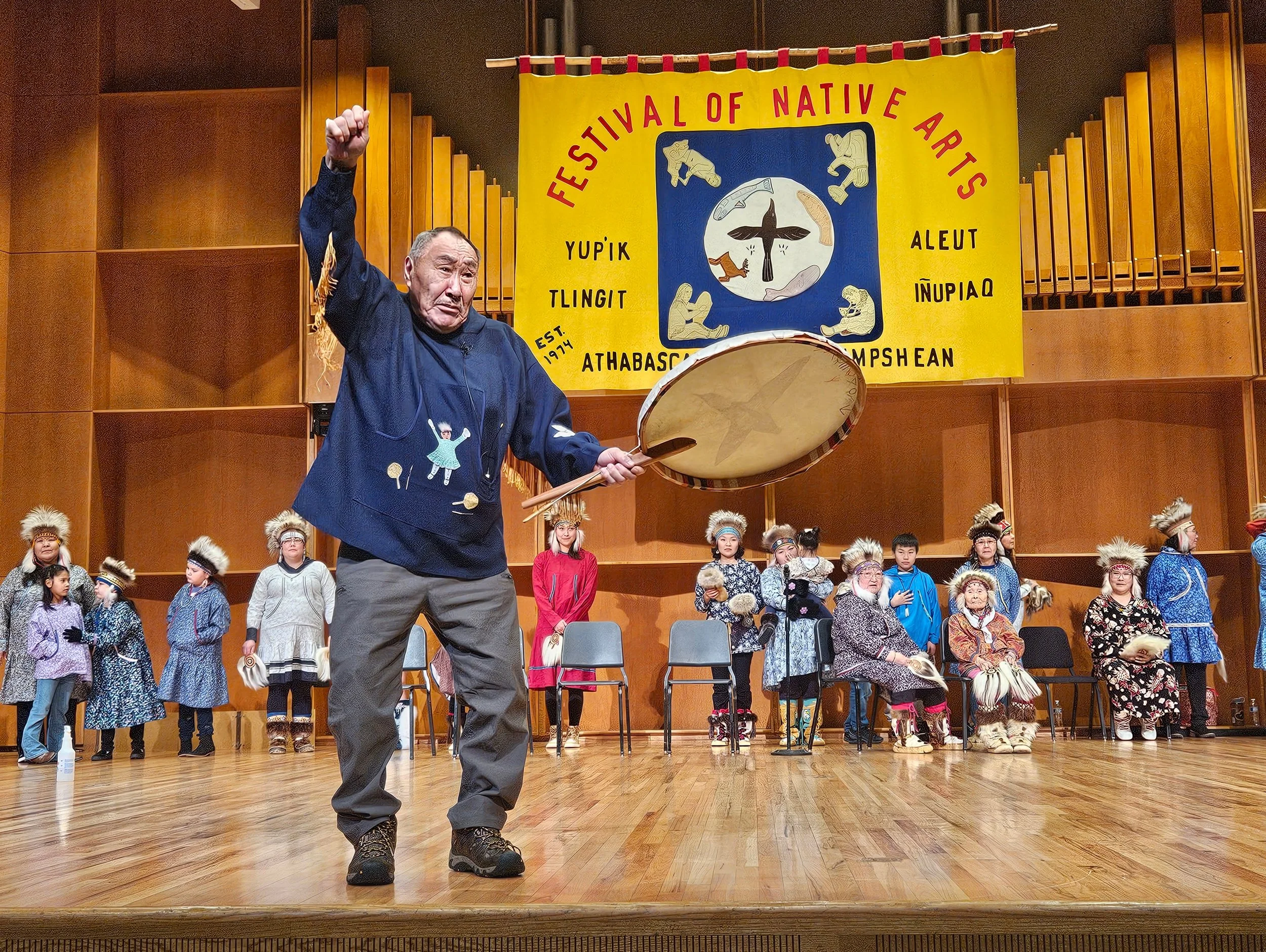 Photo by Jonathan Wasilewski - John Pingayaq of the Pingayaq Dance Group talks about Christianity during the Heartbeat of the Drums song on February 27 at the Festival of Native Arts.