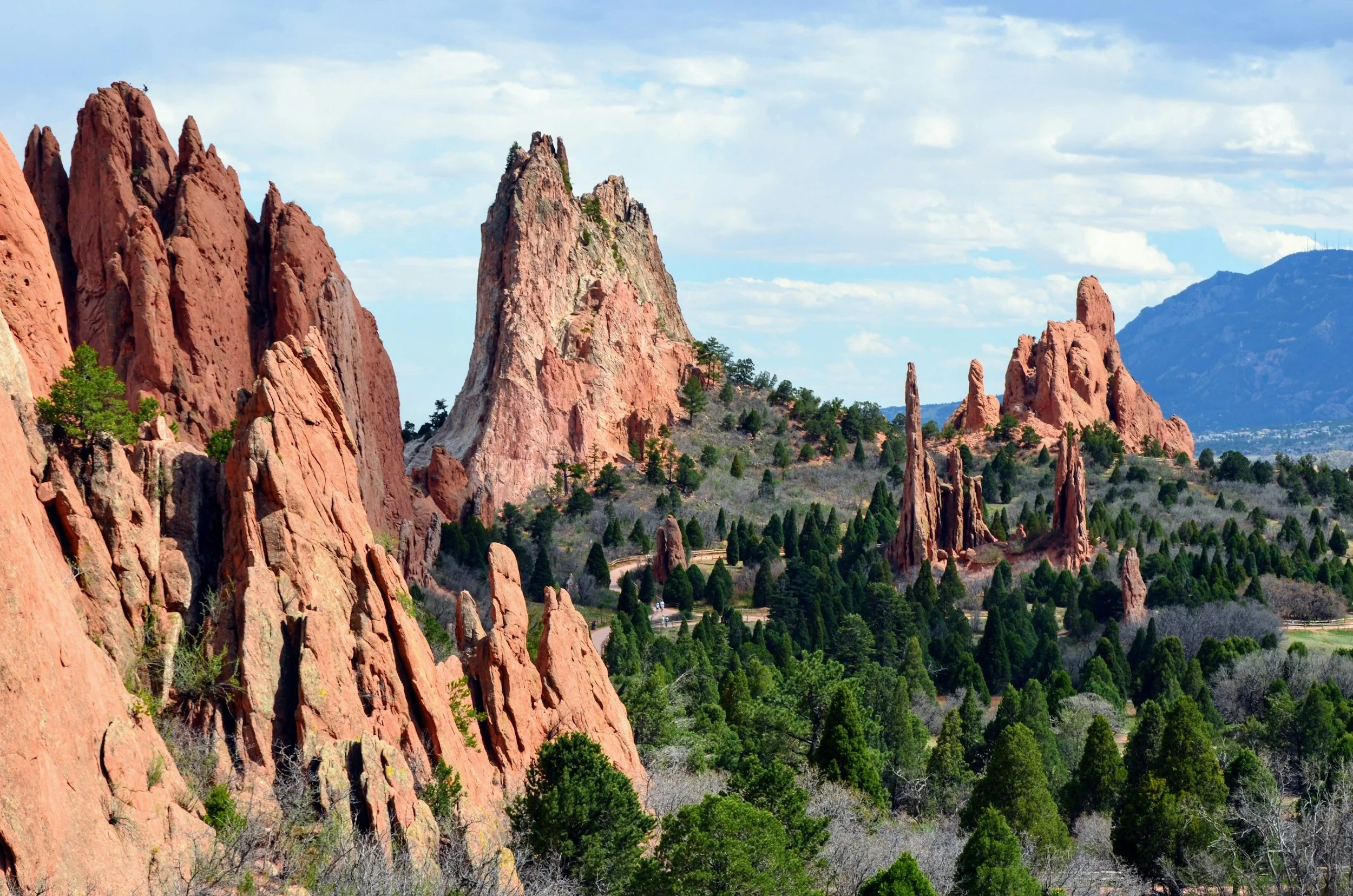 Red rock formations and green trees in Garden of the Gods, Colorado Springs, Colorado.