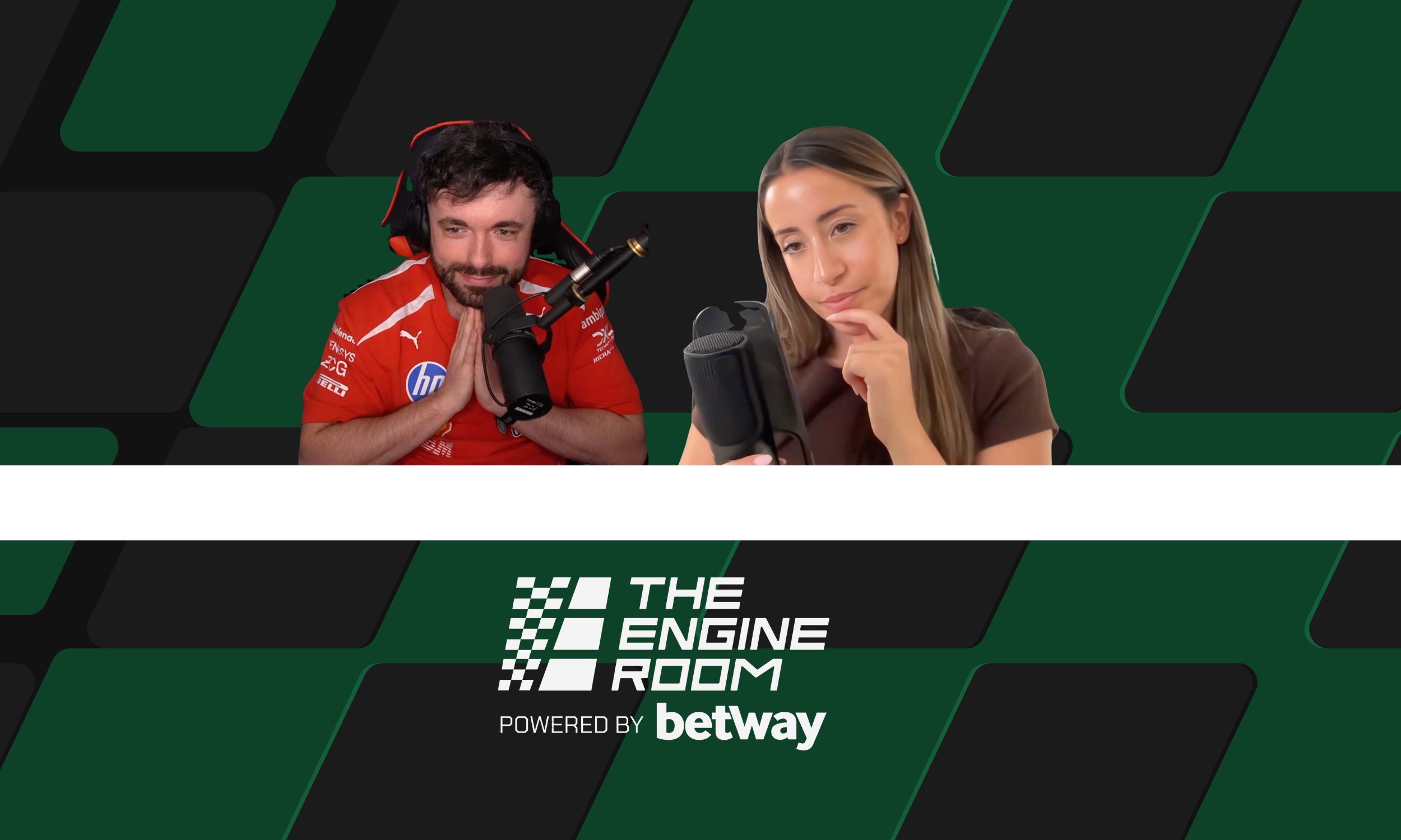 Two people, a man and a woman, sit in front of microphones during a podcast or interview. The man is wearing a red shirt with logos and headphones, clasping his hands together, and the woman is holding a phone and appears to be listening thoughtfully.