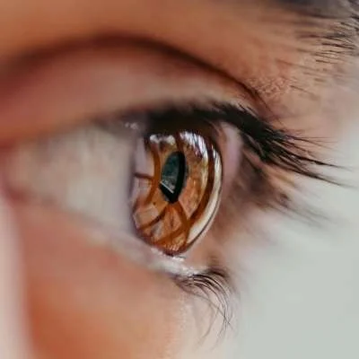 Three close-up images of a woman's eyes looking in different directions.