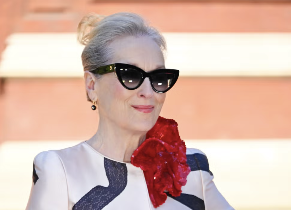 Meryl Streep's naturally grey and silver white hair swept back into elegant up-do