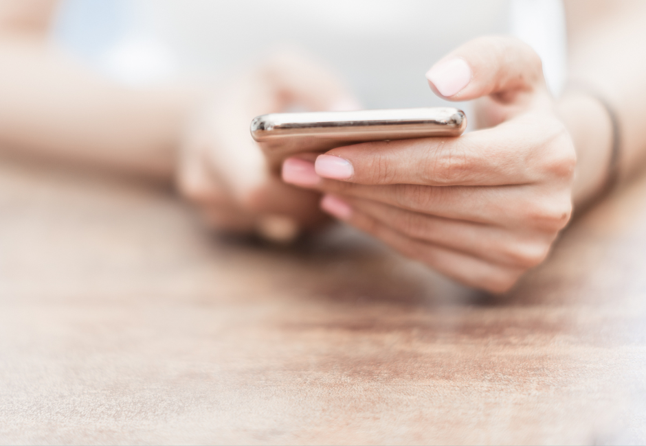 hands holding a cell phone