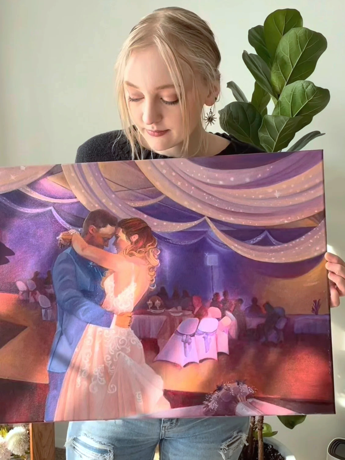 Alison Slackta, experienced artist and Michigan live wedding painter, is holding a painting of Crystal Occasions in Clio Michigan, central Michigan, mid Michigan, near Flint Michigan. Each wedding painting is unique and personalized.