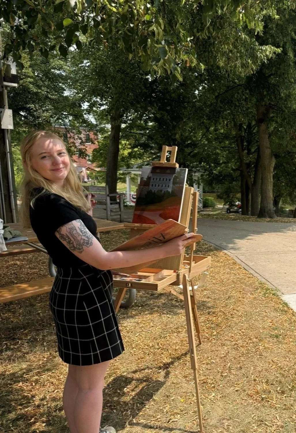 Alison Slackta, experienced artist and Michigan live wedding painter, is painting a scene live in Linden Michigan.