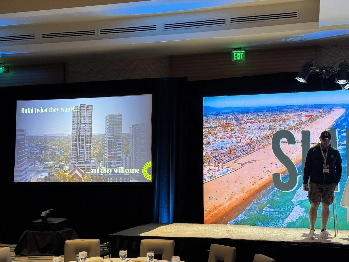 LED video wall installed behind a stage for a corporate event presentation or live performance.