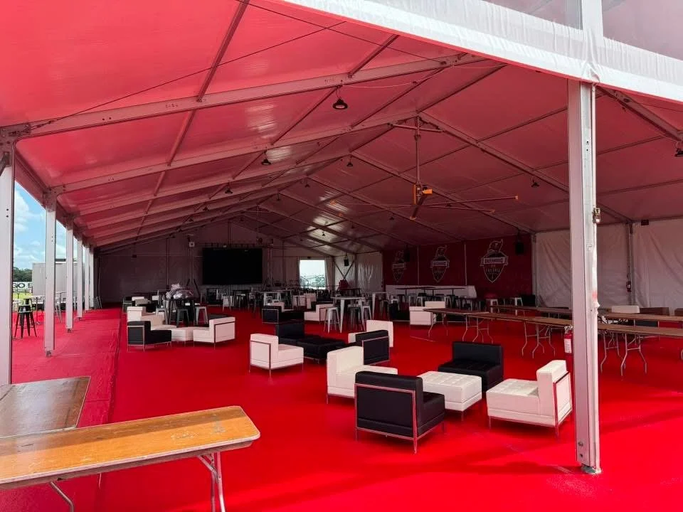 red carpet flooring under clearspan tent 