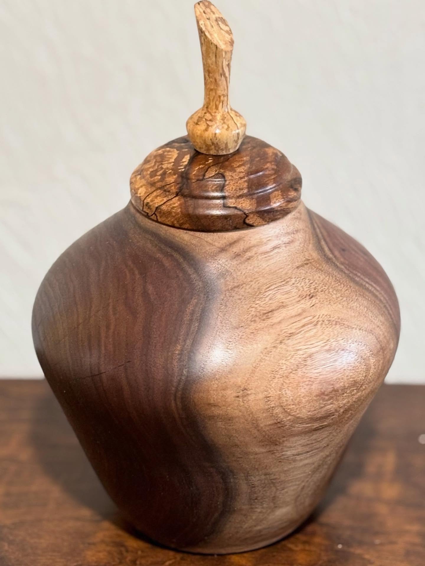 Black Walnut hollow form with English Walnut lid and finial. #woodturnedbowl #woodturnedhollowform #woodartisan #shopsmallbusinesses #holidaygiftideas #handmade