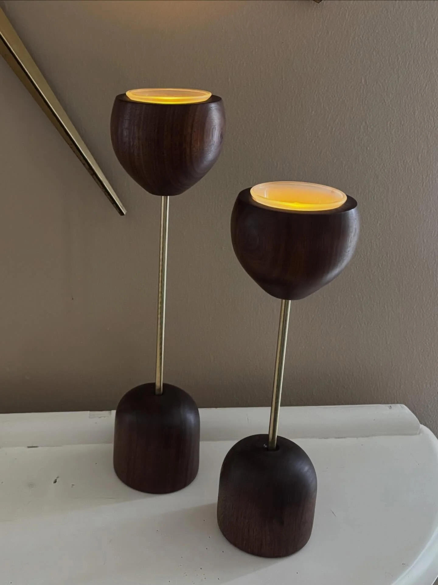 A few MCM walnut and brass candle holders. #woodturner #woodart #woodturnersofinstagram #madeinamerica #woodturnedcandleholders