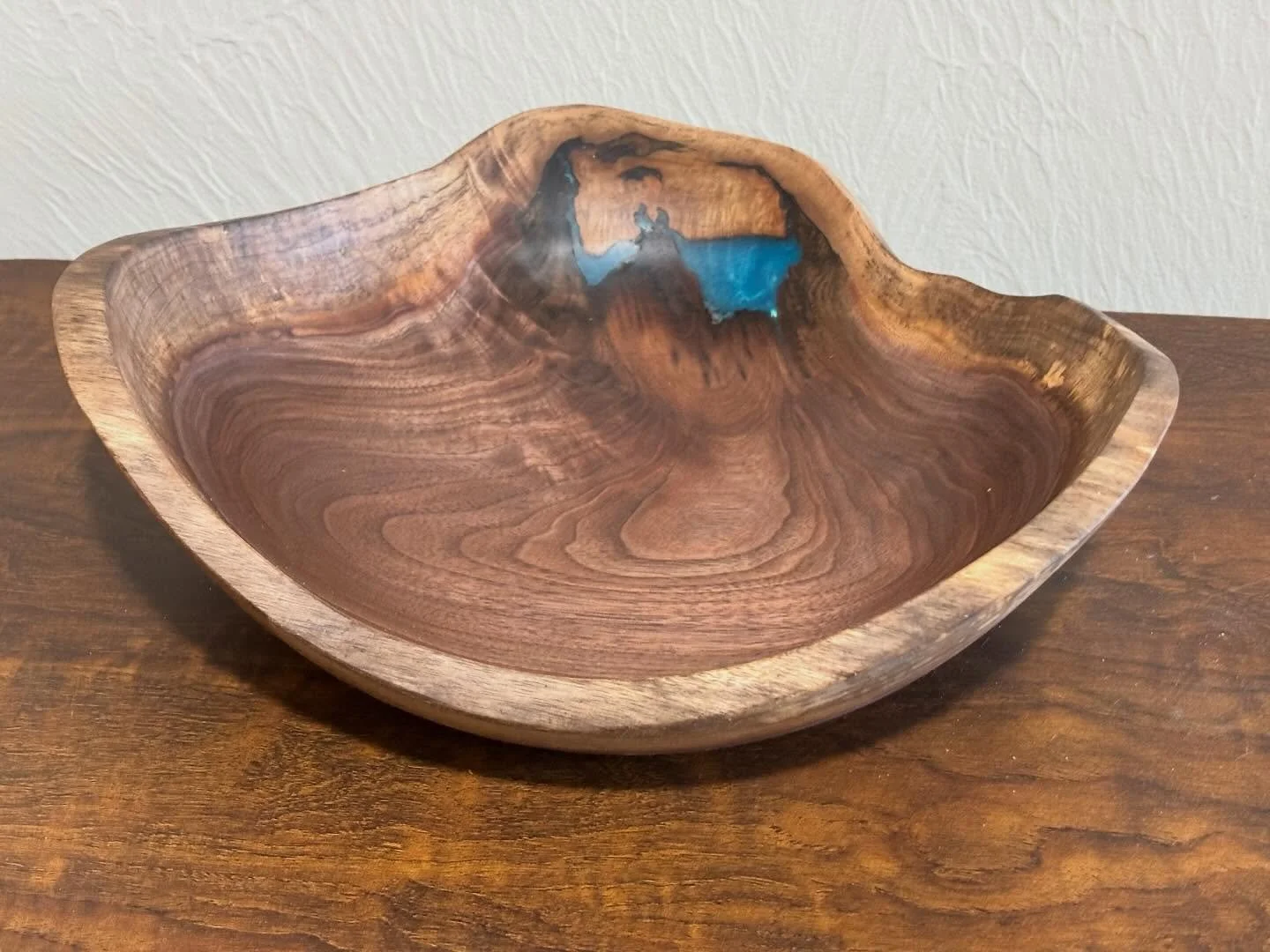 Natural edge walnut crotch with a little epoxy to fill a knot hole. #walnutbowl #woodturner #woodartisan #shopsmallbusinesses #latheturning
