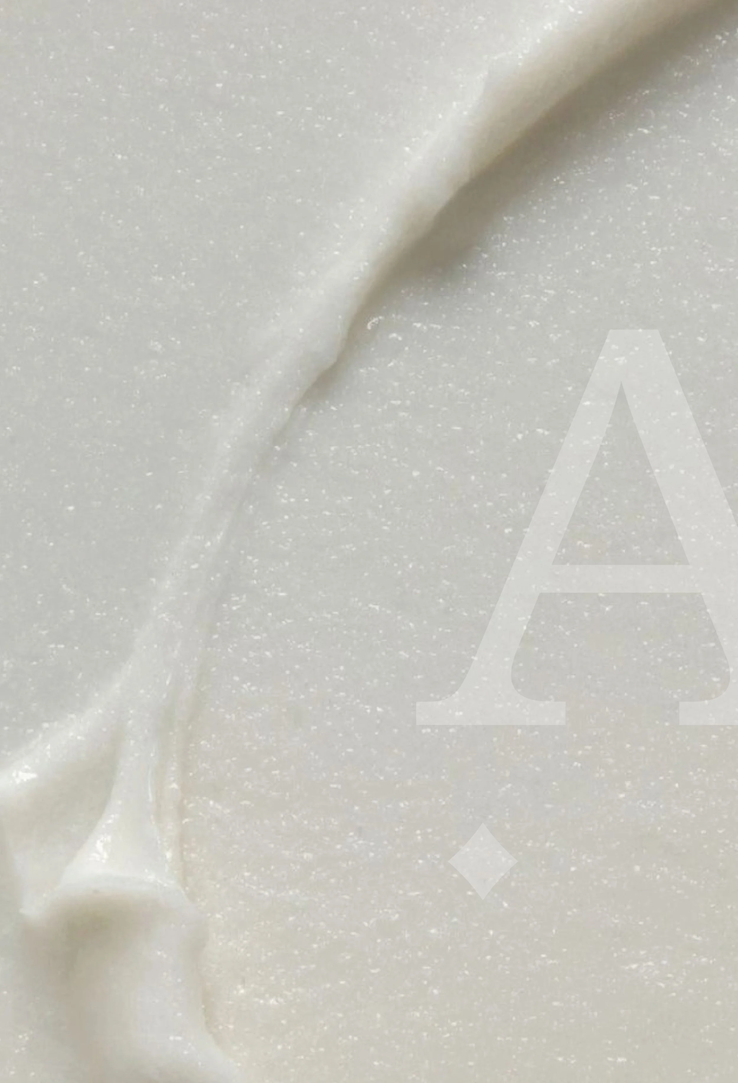 Close-up image of face cream with letter A sitting on top referring to Amia Skincare brand tone