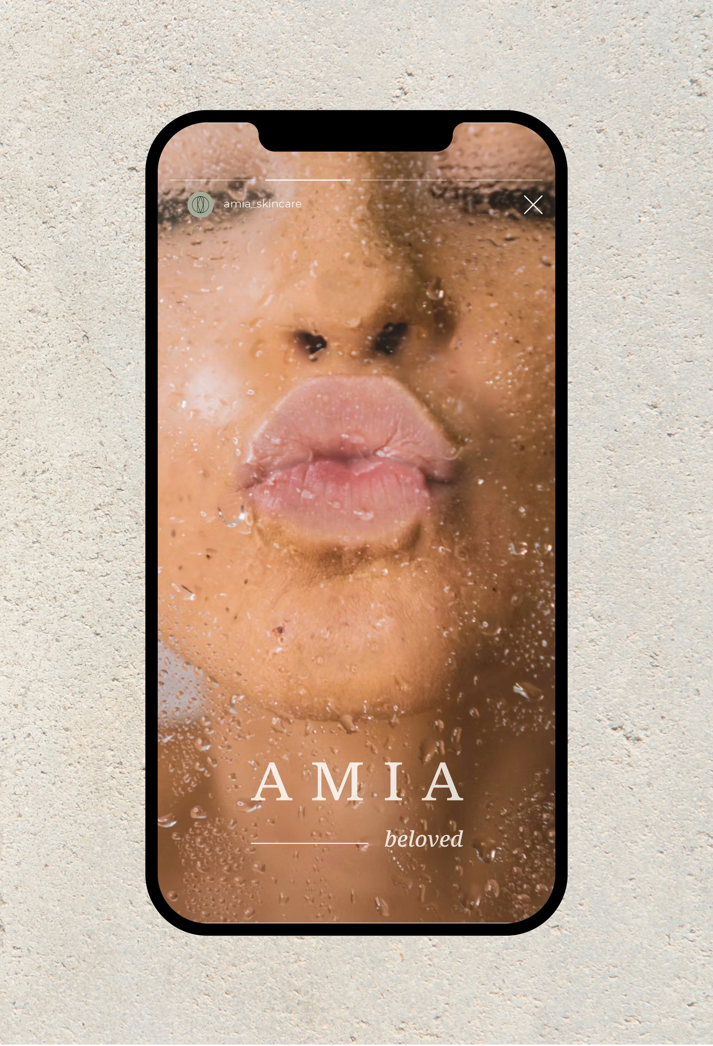 Image of mobile phone showing social post concept for Amia Skincare