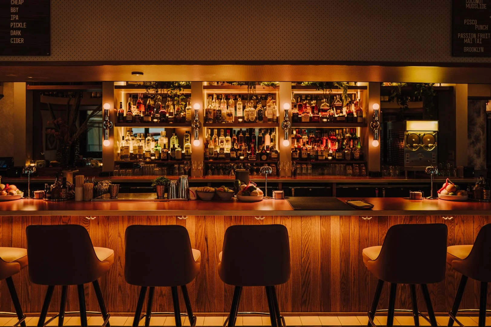 Double Fun bar interior with illuminated back bar by Siren Betty Design.