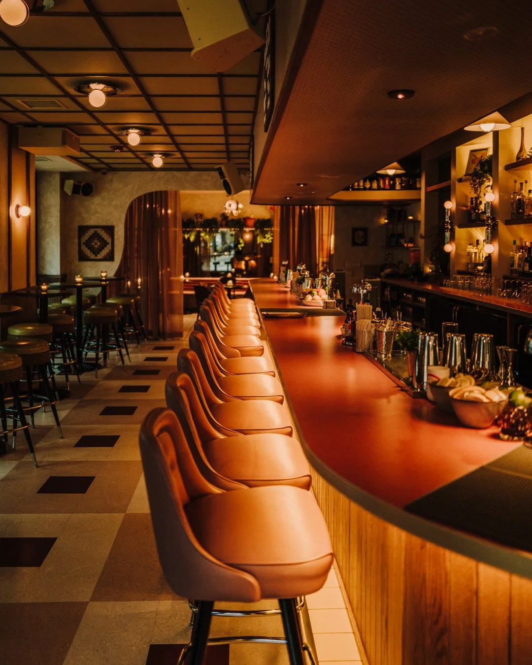 Double Fun curved bar seating with wood finishes by Siren Betty Design