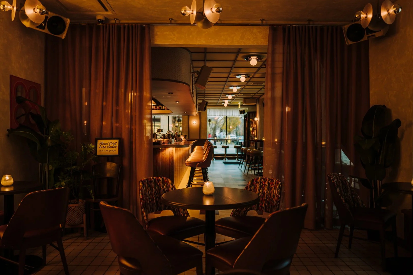 Double Fun dining area with curtain divider designed by Siren Betty Design.