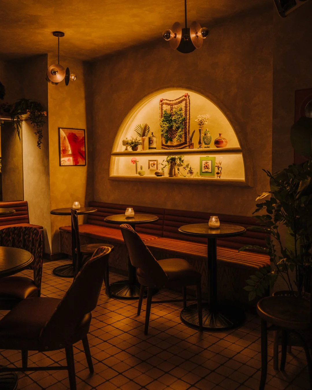 Double Fun lounge seating with upholstered chairs, tiled floors, and soft lighting by Siren Betty Design.