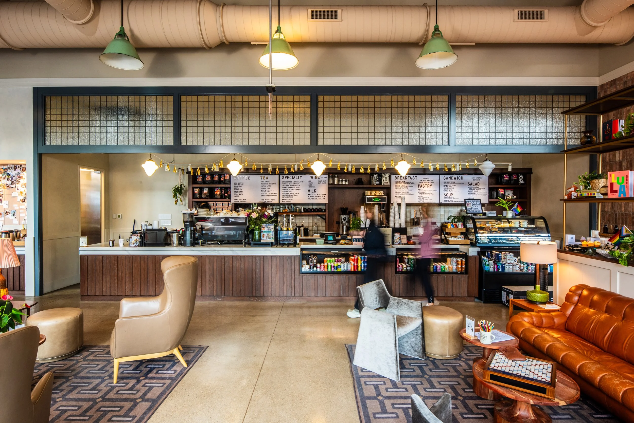 Layla and Ringo’s interior with coffee counter, menu boards, lounge seating, and warm layered décor by Siren Betty Design