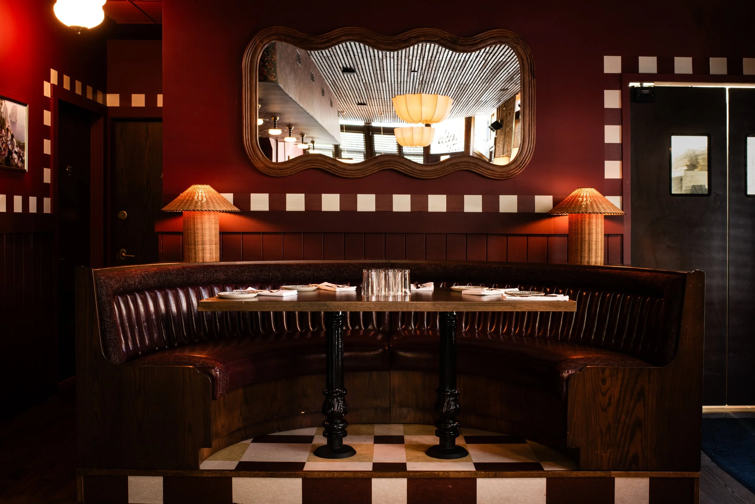 Dimmi Dimmi, Chicago with leather banquette, patterned walls and flooring by Siren Betty Design.