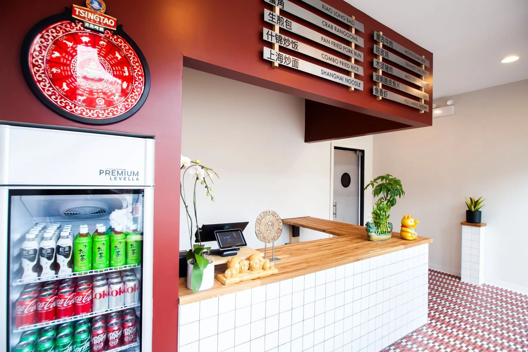 Moon Palace Chicago by Siren Betty Design, front counter with tiled facade, red menu board, and vintage-inspired decor.